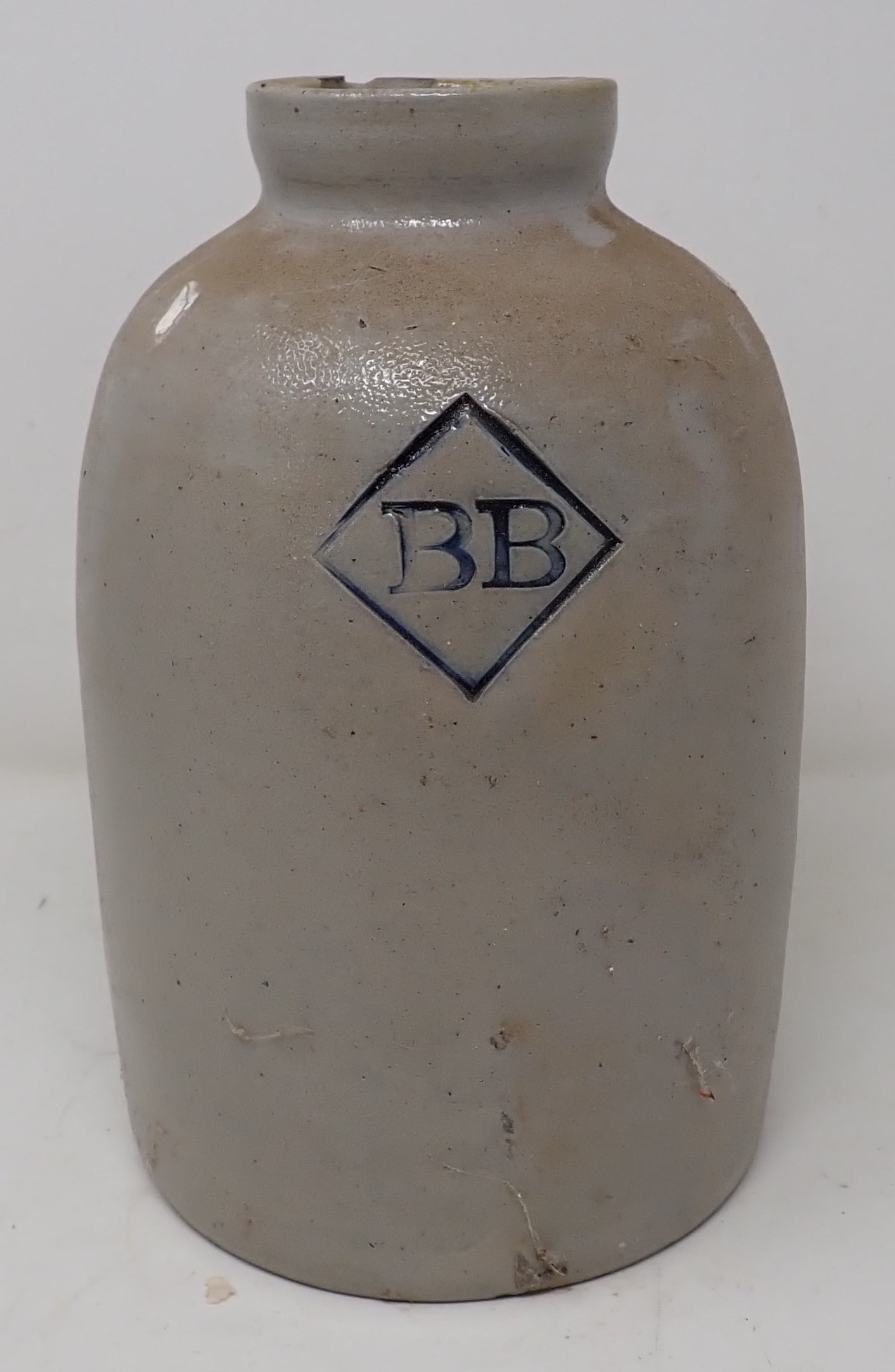 BB Stoneware Jug: Approx 6" in diameter and 9 1/2" tall
