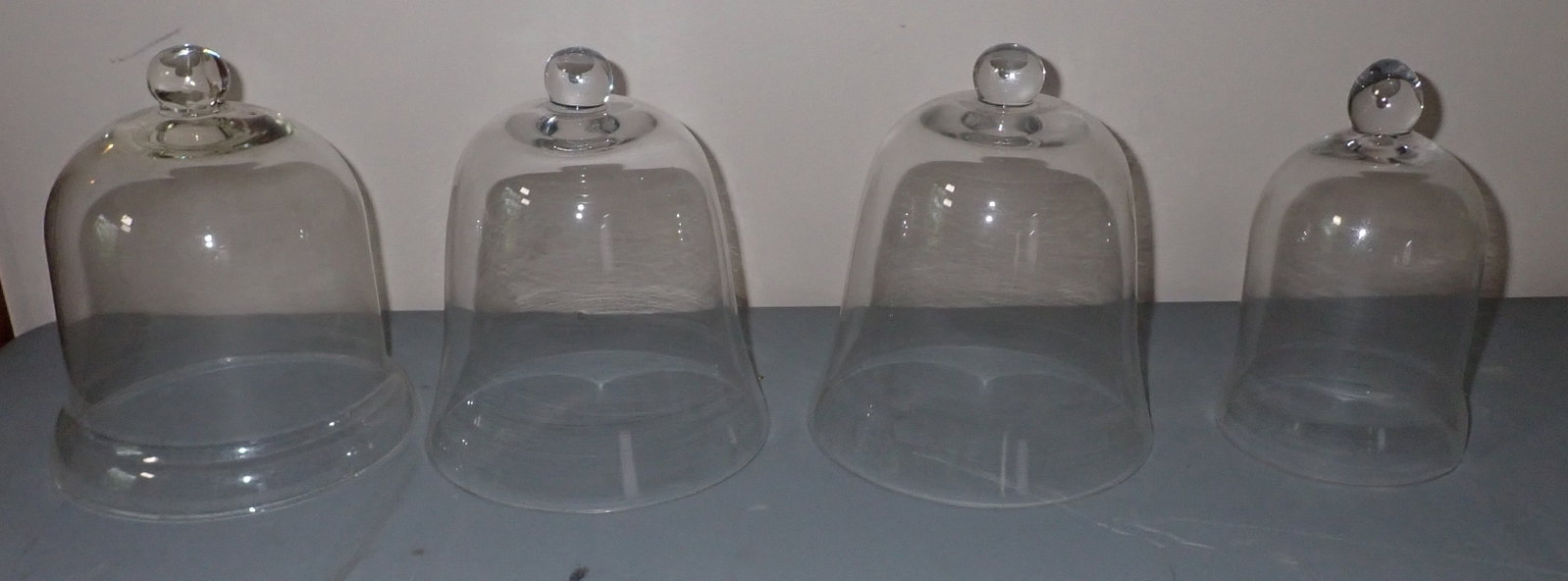4 Dome Cloches: Largest is apprx 6 1/4" in diameter and 7 1/2" tall. Tote is also included