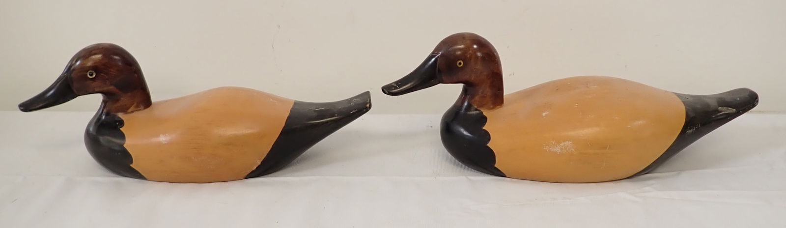 2 Wooden Duck Decoys: Largest is approx 6 1/4" x 17 1/2" x 6 1/2" tall.