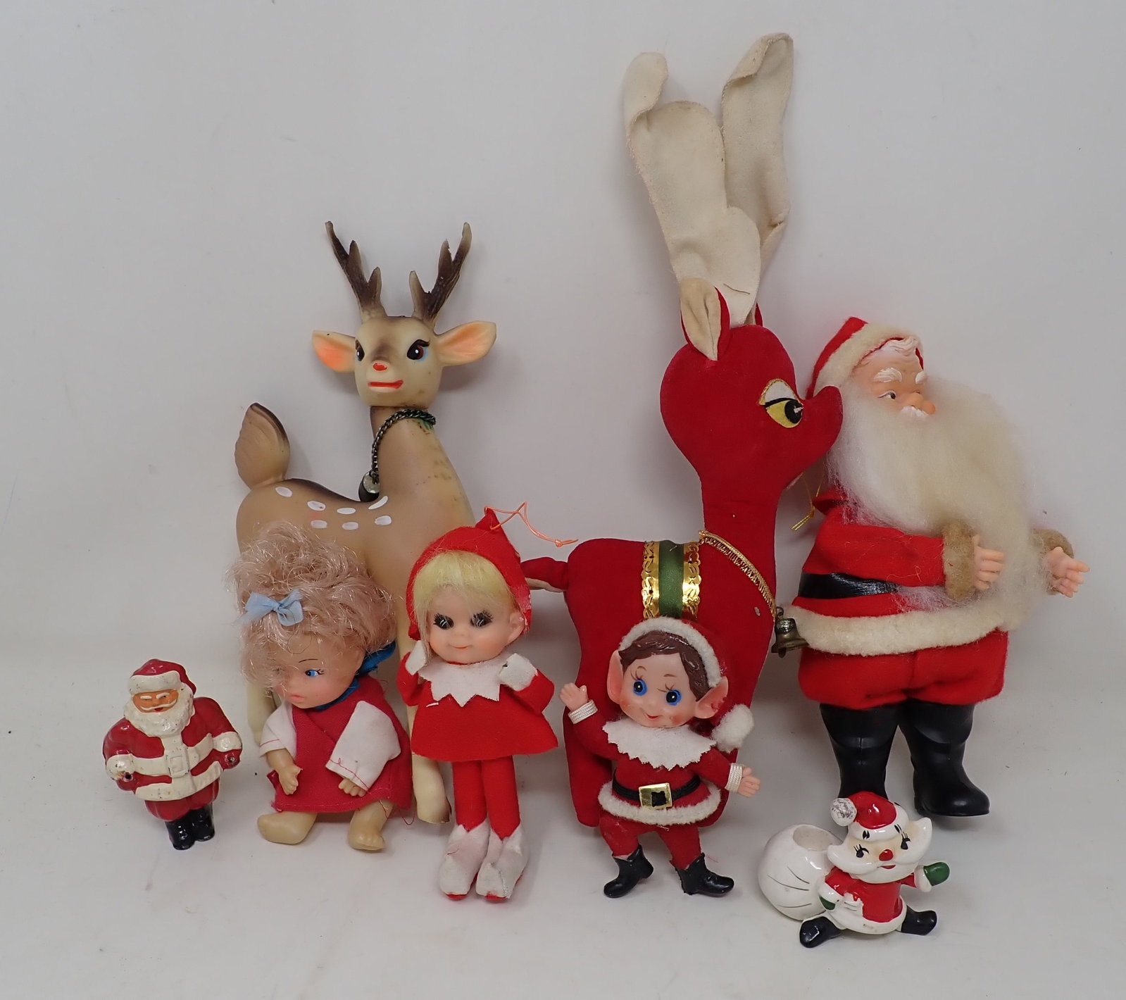 Christmas Decorations: Back right Santa is approx 7 1/4" tall. Far left Santa is pot metal