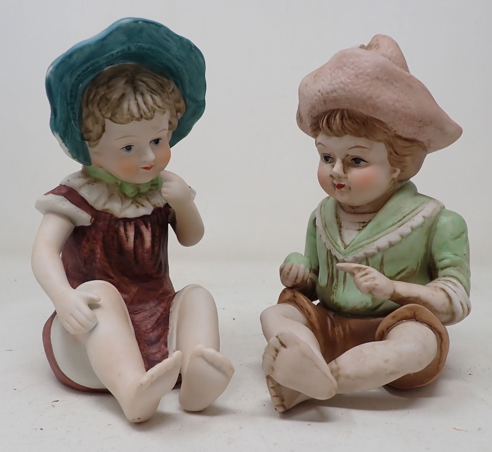 2 Bisque Piano Dolls: Approx 6 1/2" tall.