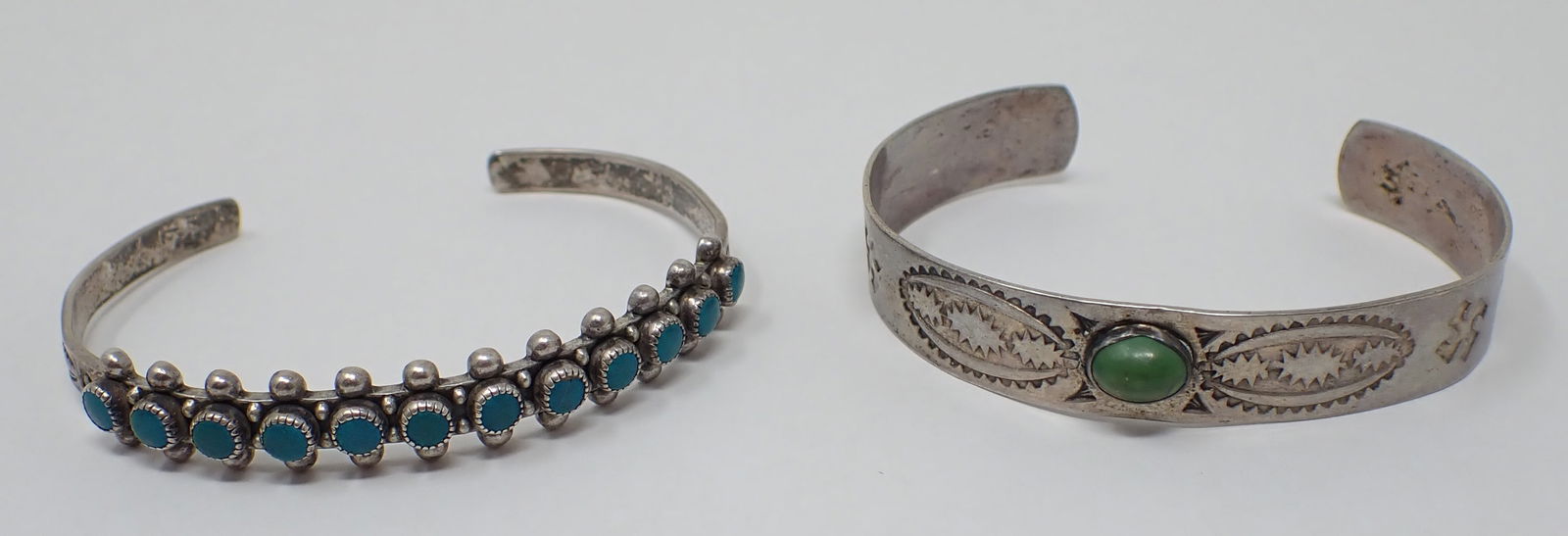 Sterling Silver Cuff Bracelets: Left one is marked Sterling and is approx 2 1/4" wide with a 1" opening. One on right is not marked or guaranteed Sterling