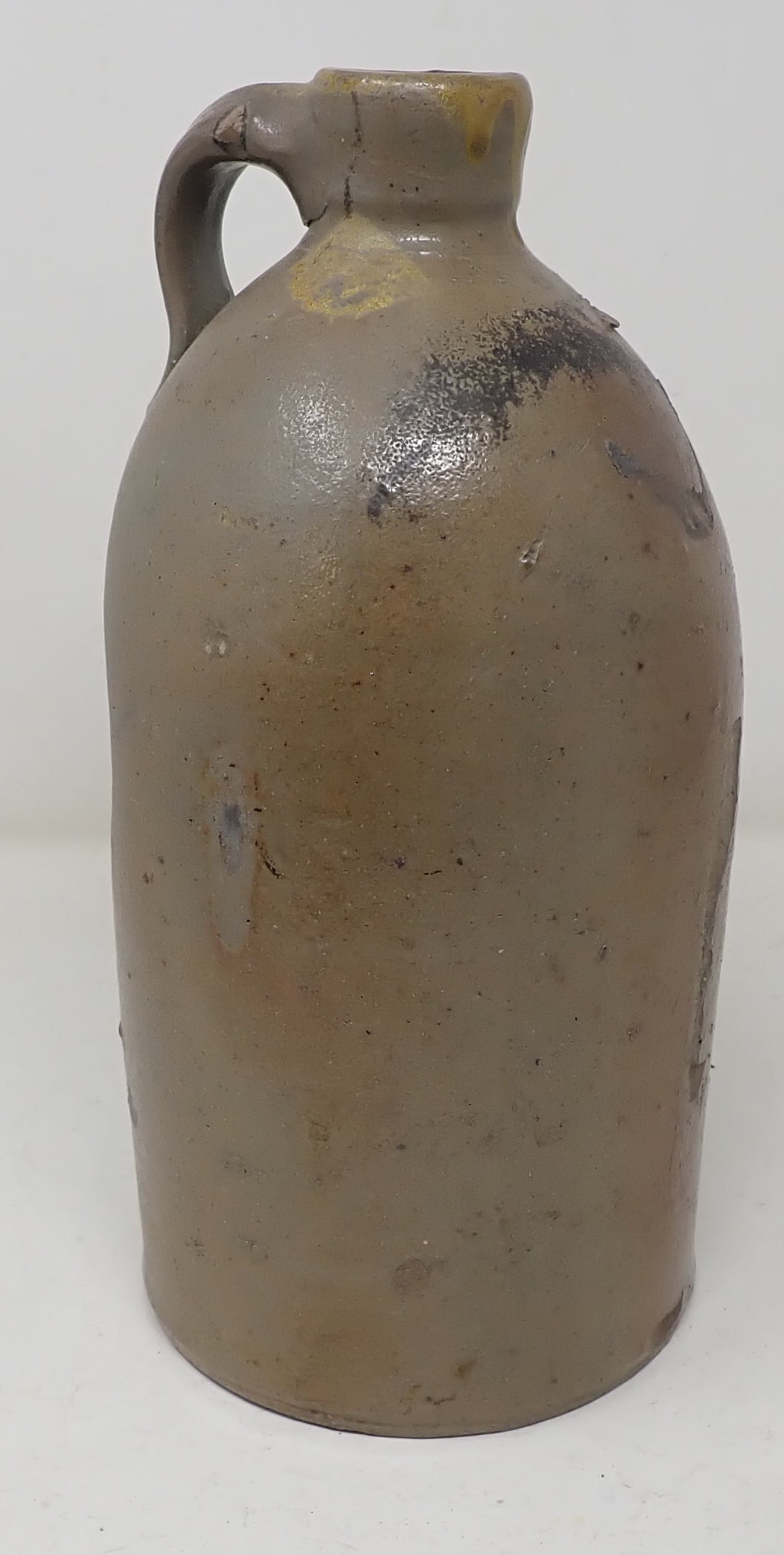 Stoneware Jug w/ Dimples: Apprx 5" in diameter and 10 1/2" tall.