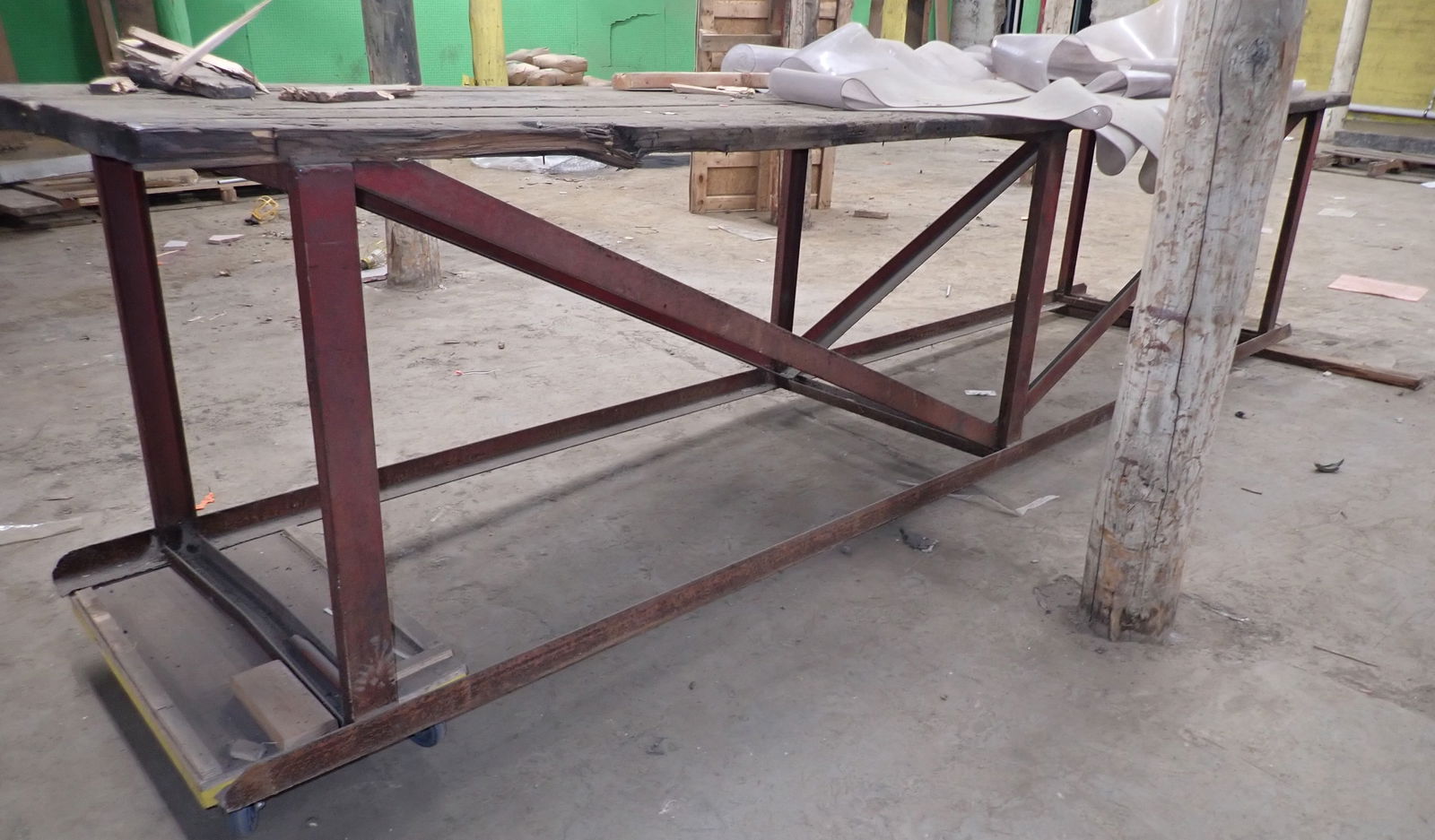 Iron Base Work Table: Apprx 34" X 13'11" x 37 1/2" tall. Bring proper help and equipment to remove. Pick up at Building B Location. No in house shipping !