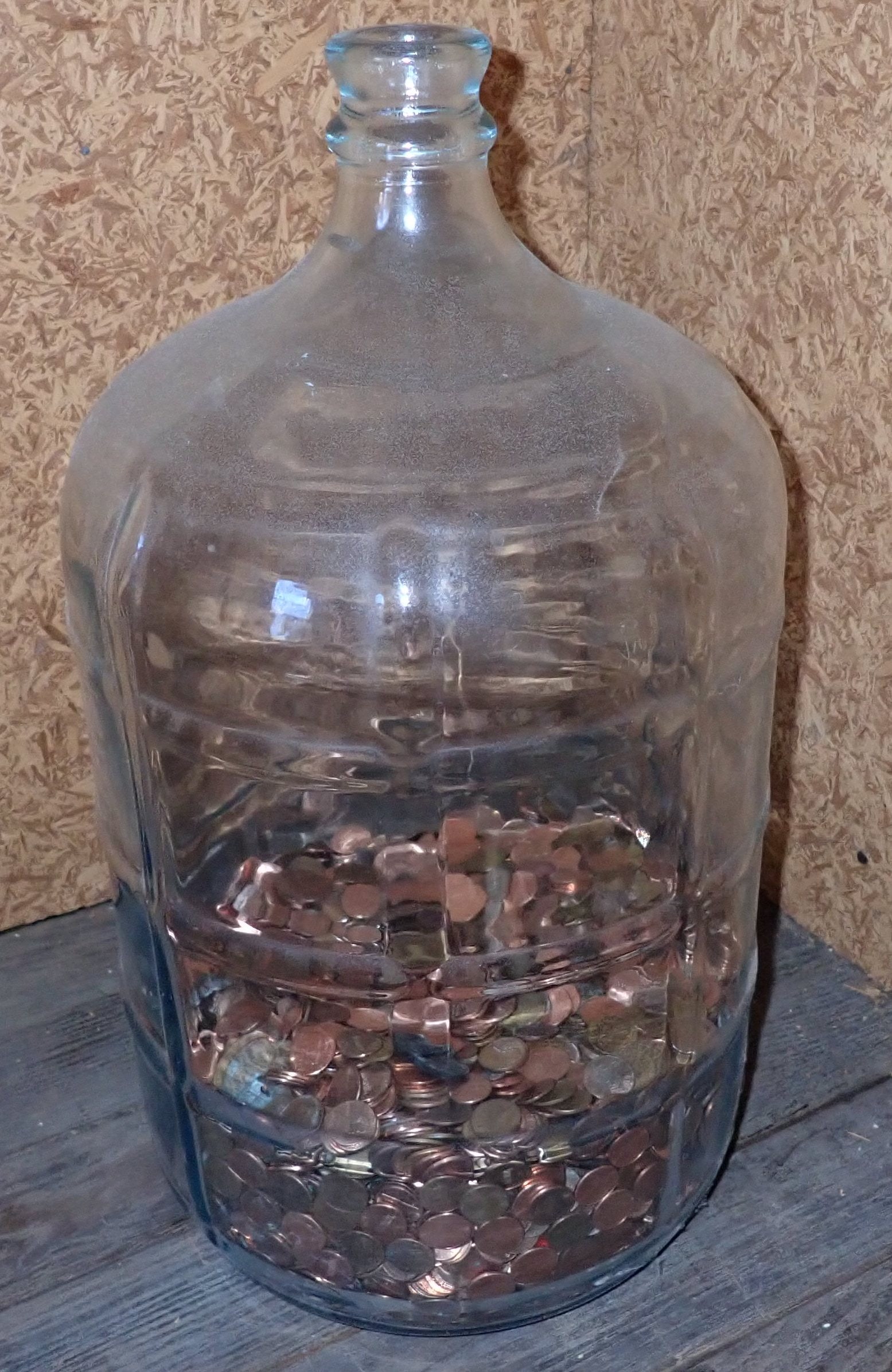 5 Gallon Glass Water Bottle w/ Pennies: No in house shipping ! Buyer to remove from second floor.