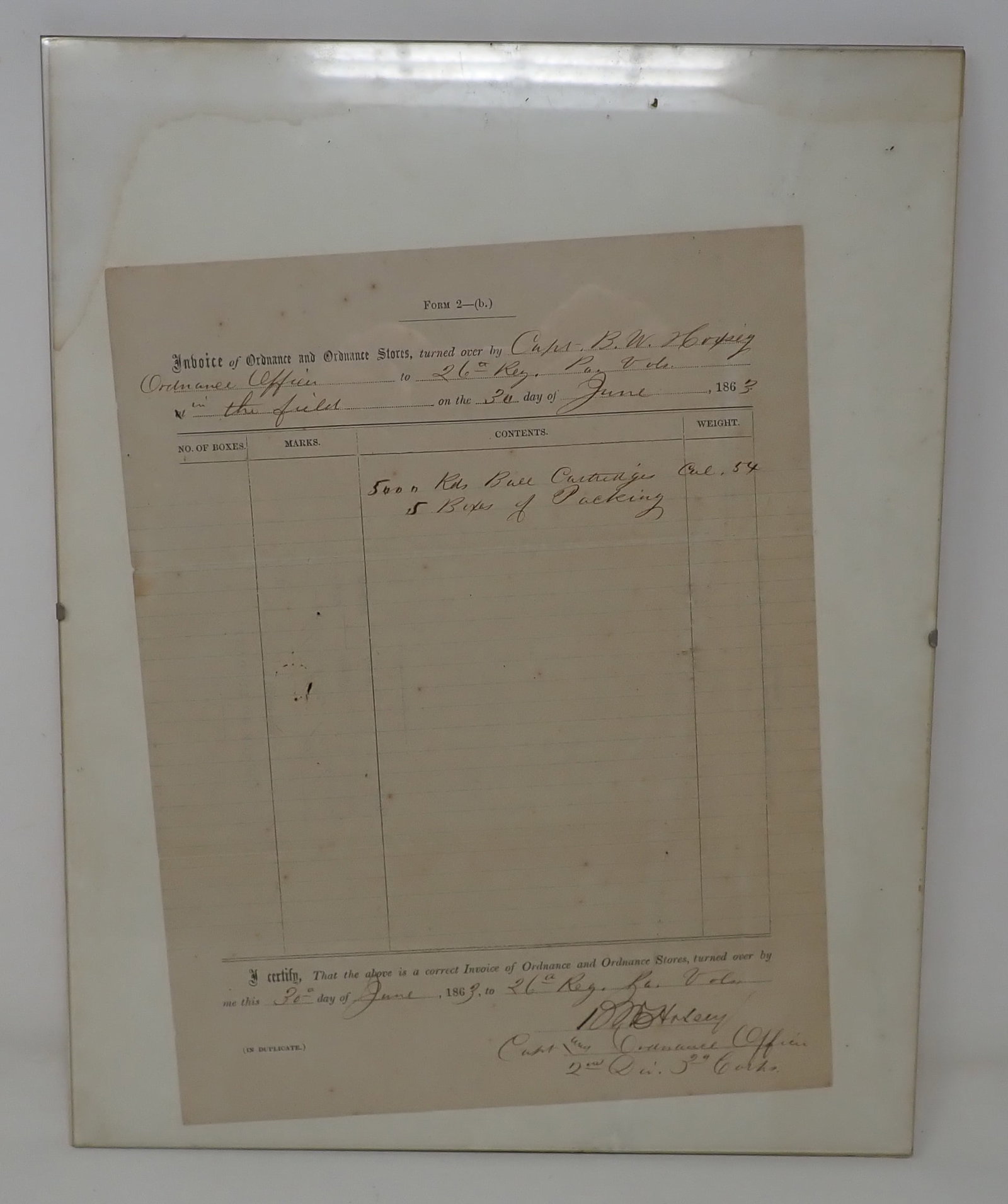 1863 Civil War Invoice of Ordnance 26th Regiment: Invoice for 5000 Rounds of ball cartridges 54 Caliber and 5 boxes of packing. Overall measurements of glass it is in , is approx 11" x 14". Shipping available.