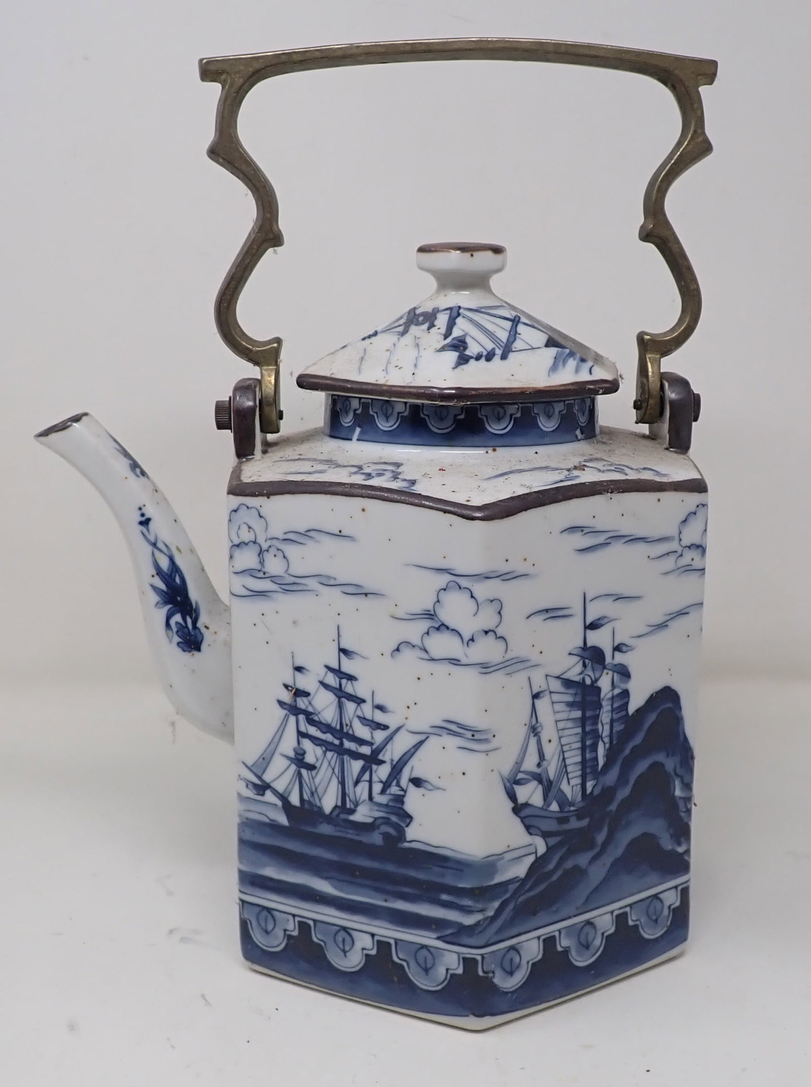 Teapot with Cutter Ships: Approx 11 3/4" tall. Handle is brass. Shipping available.
