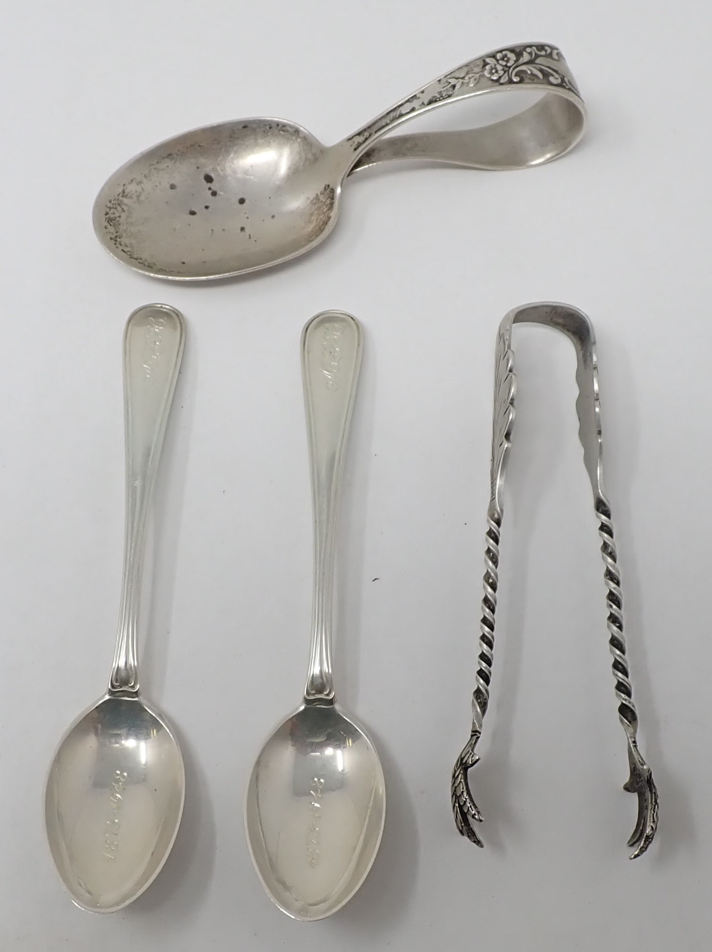 Sterling Silver Tongs Baby Spoons: 2 Spoons on left are by Shreve Crump & Low and are approx 4 1/4" long. They are monogrammed and dated 1873-1948. All items are marked Sterling . Total weight is apprx 60 grams.