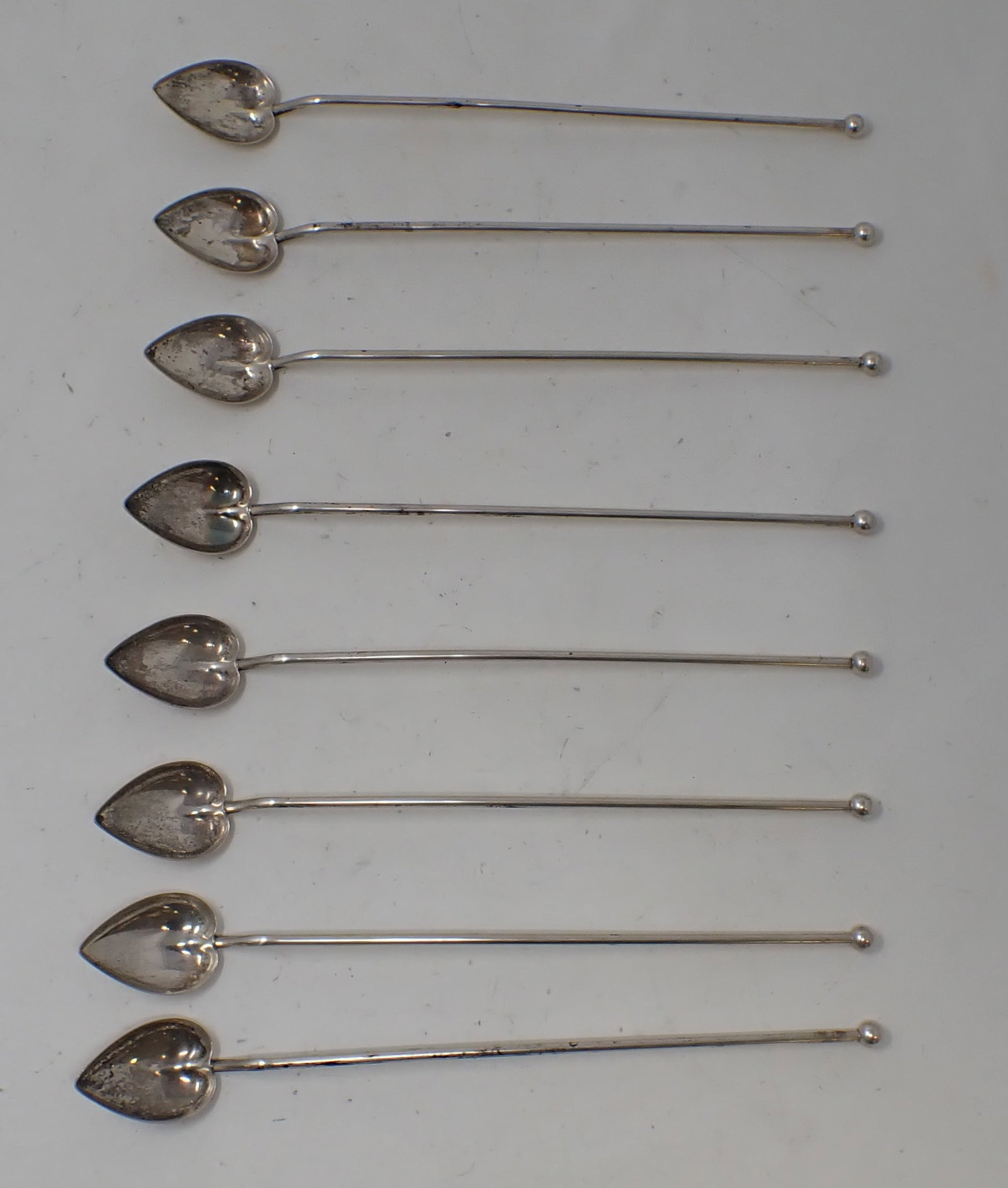 8 Sterling Silver Stir Straws: Apprx 8 1/4" long. Total weight is apprx 100 grams . Have "M" monogram on them. Shipping available