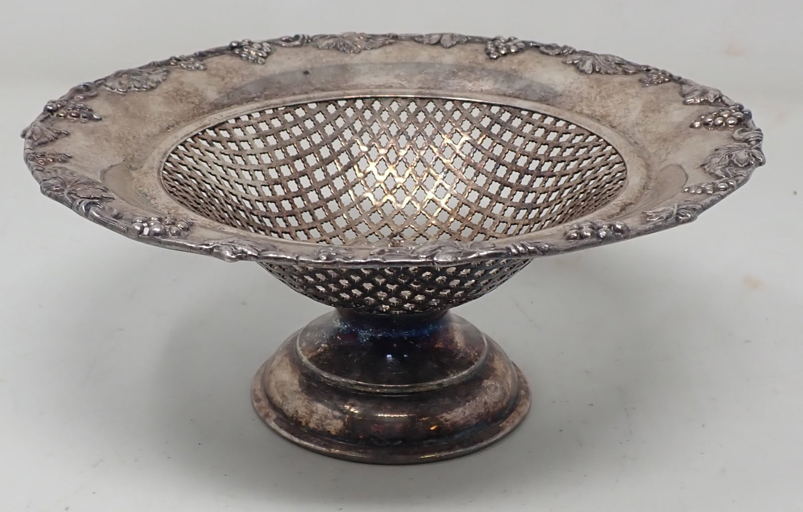 Reticulated Grape & Wreath Design Basket: Approx 7" in diameter and 3 1/4" tall. Shipping available.