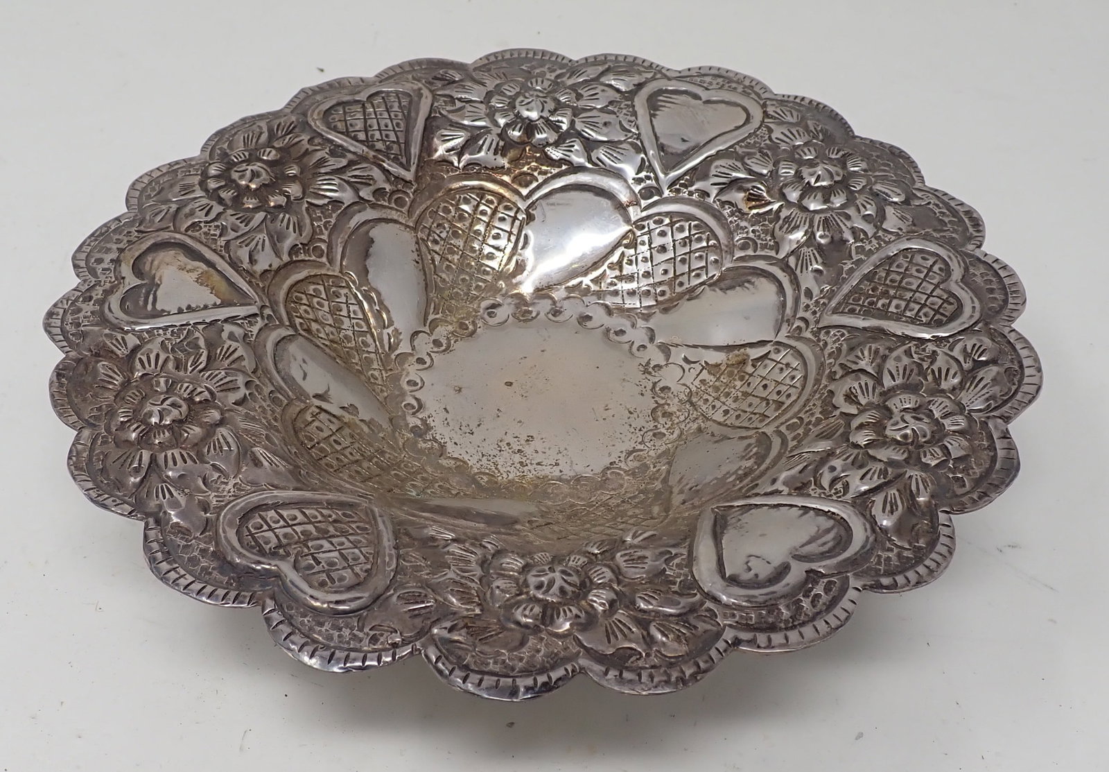 Repousse Footed Candy Dish: Apprx 7 3/4" in diameter and 1 7/8" tall. This is not marked, guaranteed, or said to be Silver. Weighs approx 235 grams. Shipping available.