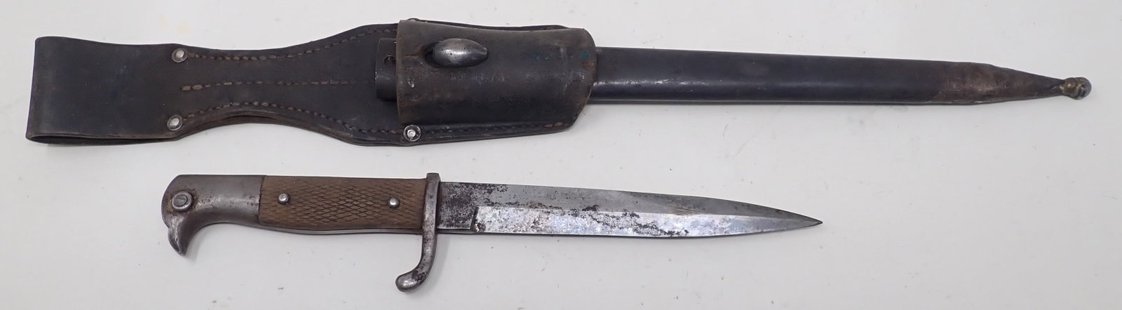 German Trench Knife and Sheath: Knife is approx 10 3/8" long. It is not the correct sheath for it. Shipping available