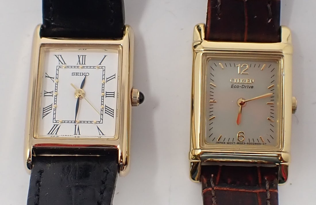 2 Lady's Wrist Watches: Rectangular dials, gold-tone. Including a Seiko water resistant 1N01-0LK0 with a black leather band; and a Citizen Eco-Drive B023-S071011 with a brown leather band. Not tested for working condition.