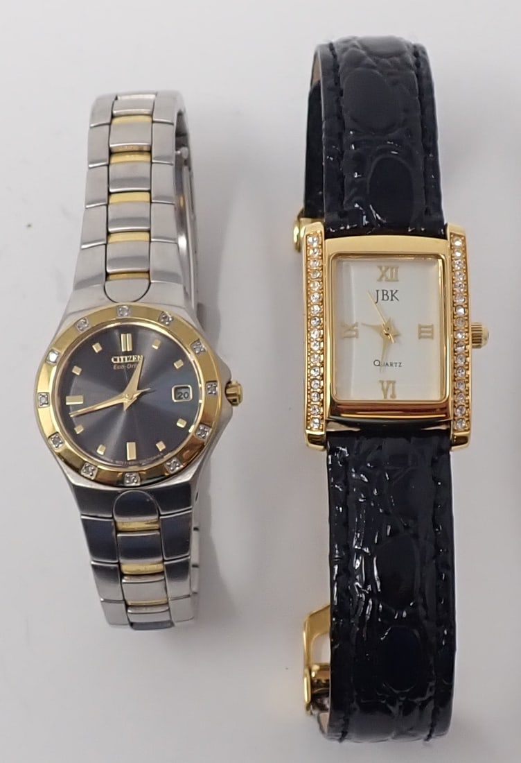 2 Lady's Wrist Watches: Including JBK by Camrose & Kross, base metal and stainless steel, black leather band with click clasp; along with a Citizen Eco-Drive water resistant. Not tested for working condition.