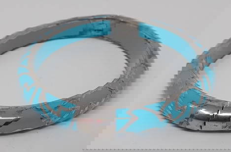 Angelique de Paris Bangle Bracelet: Silver and turquoise colored enamel, hinged construction, approx. 0.25" wide.