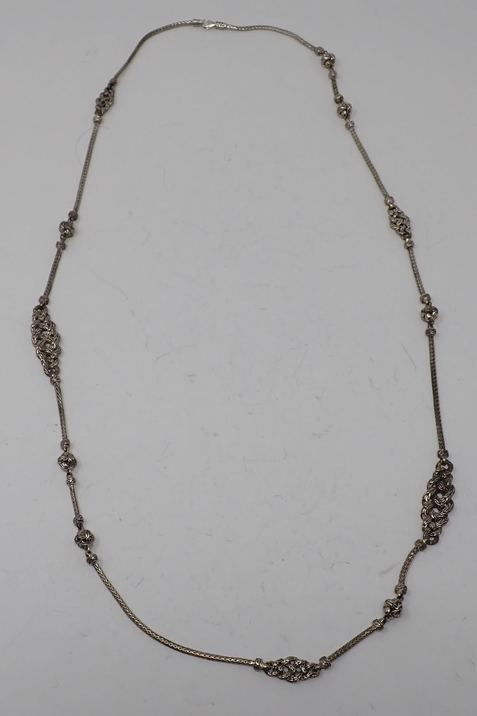 John Hardy Sterling Necklace: 36" braided chain with scattered sections of intertwined design, 1.87 ozt.