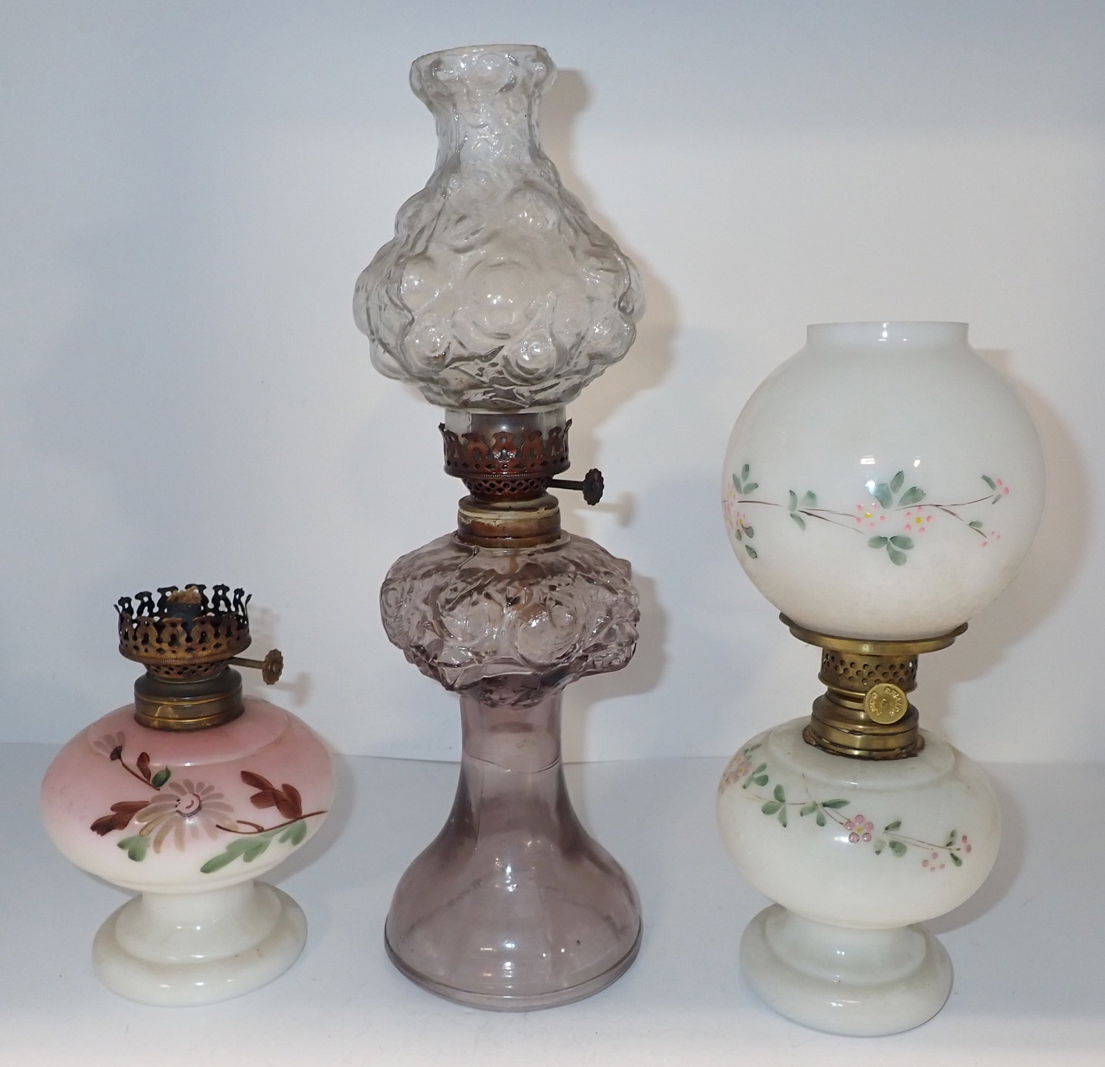3 Miniature Oil Lamps: Tallest is apprx 12 1/4" tall. Shipping available ($20 handling charge)