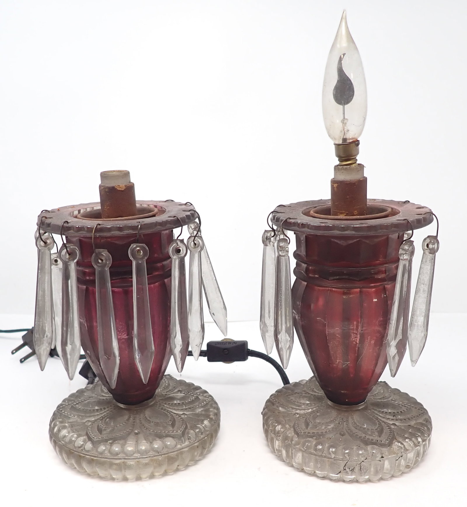 Pair of Cranberry Glass Table Lamps: Approx 3 7/8" in diameter and 6 1/4" tall ( not including height of fixture). Shipping available .