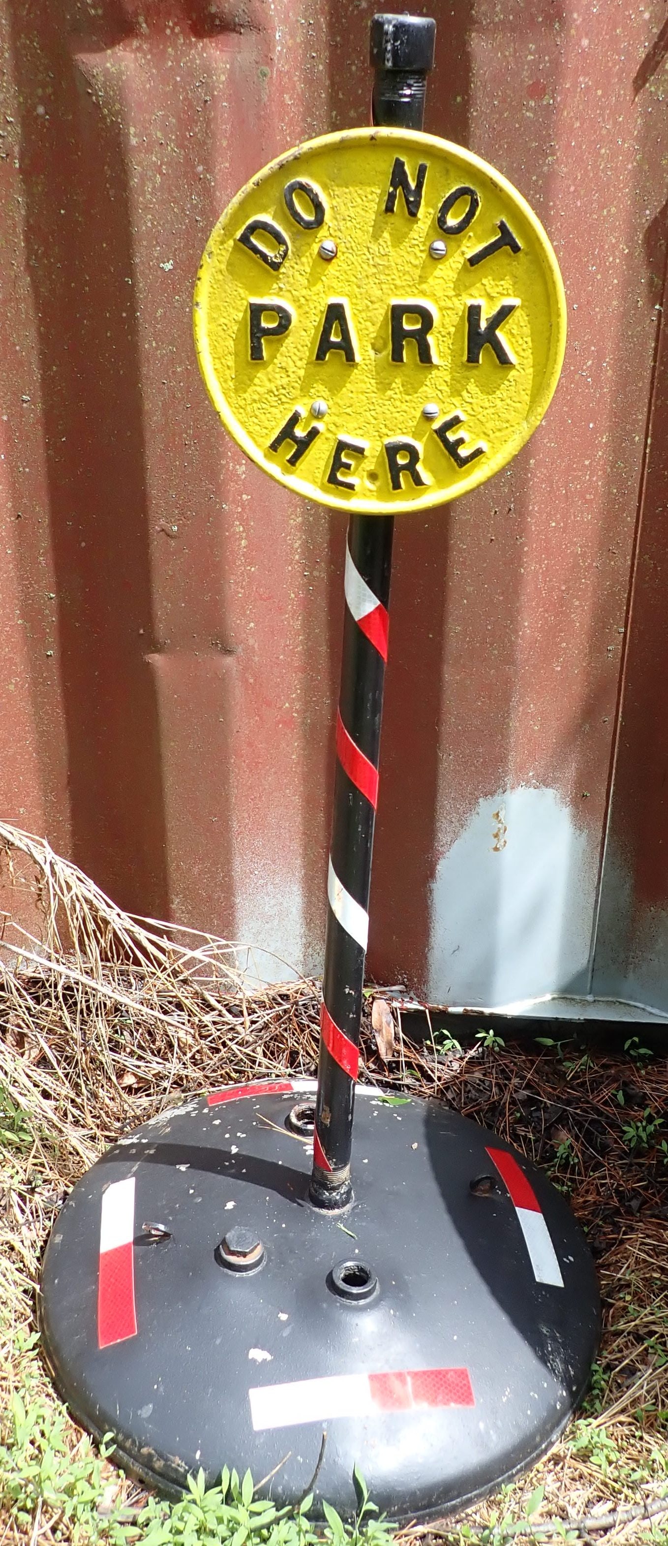 Cast Iron Do Not Park Here Sign: Sign is approx 9 5/8" in diameter. Total height is apprx 42". No in house shipping ! Came from Goodland Nudist Camp in Hackettstown. No in house shipping !