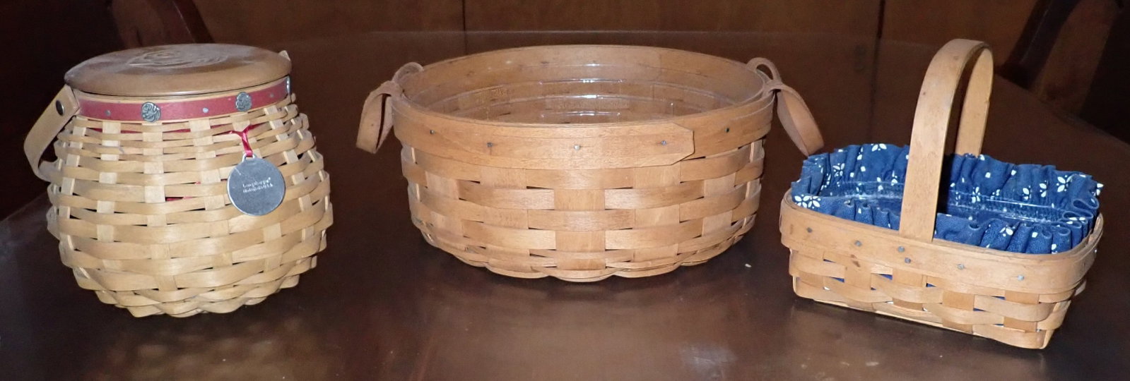 3 Longaberger Baskets: Middle one is apprx 9 1/2" in diameter and 4" tall. Shipping available