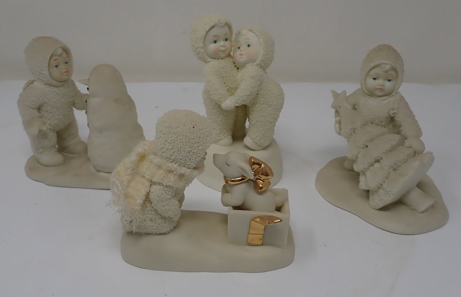 4 Snowbabies: Tallest is apprx 5" tall. Shipping available