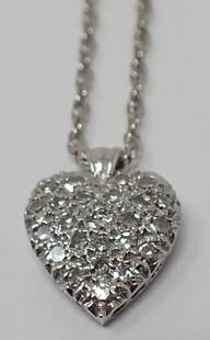 Diamond Pendant on Chain: 14K white gold 19" chain supporting a 14K white gold heart penand with pave set single cut diamonds, heart is approx. 13mm x