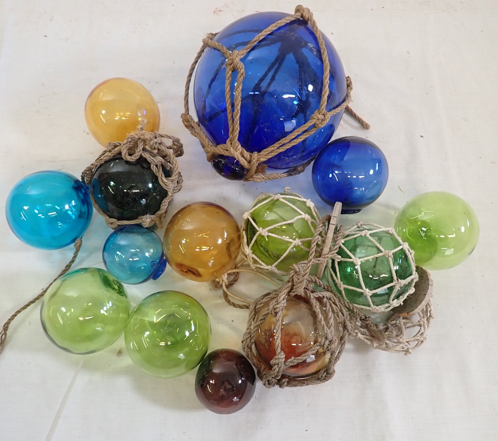 Blown Glass Fishnet Balls: Largest is approx 5 3/4" in diameter. Shipping available ($25 handling charge, plus postage)