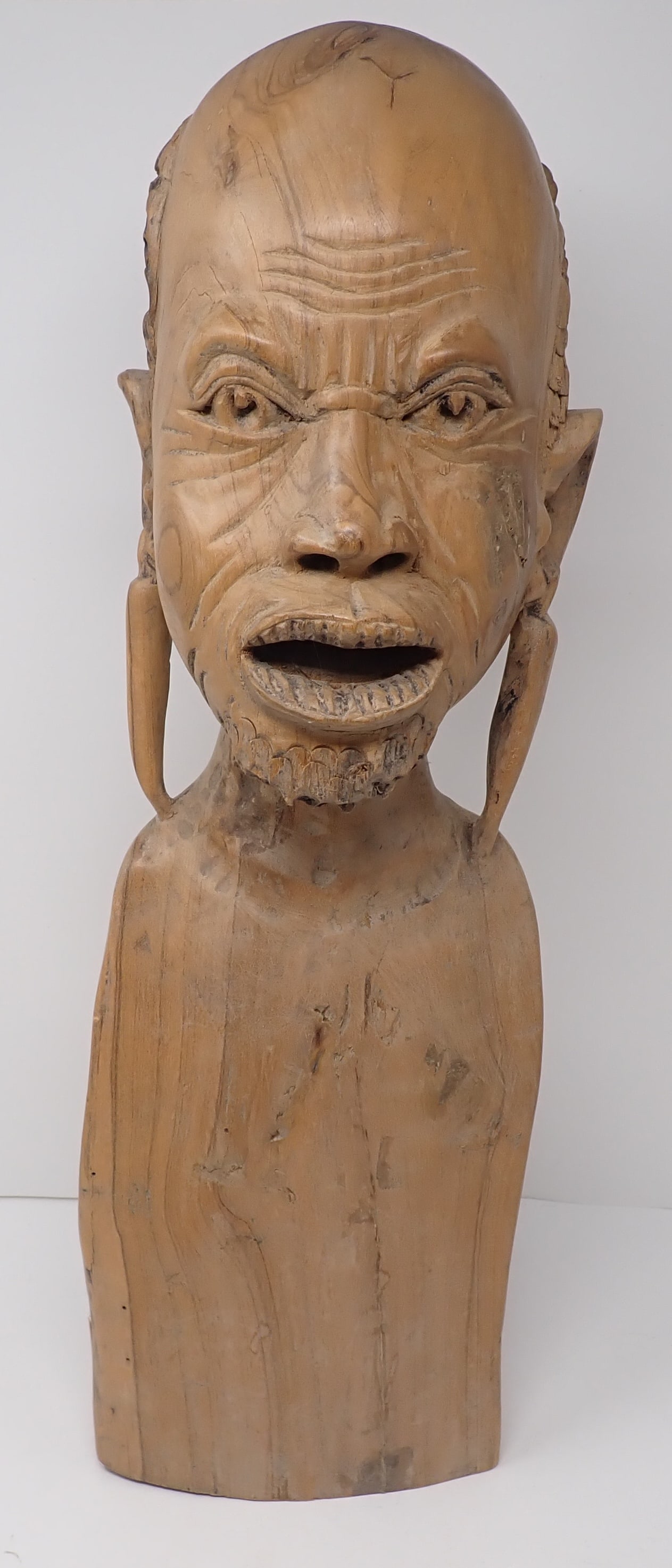 East African Wooden Carved Bust: Apprx 21 1/4" tall. Shipping available ($25 handling charge, plus postage)