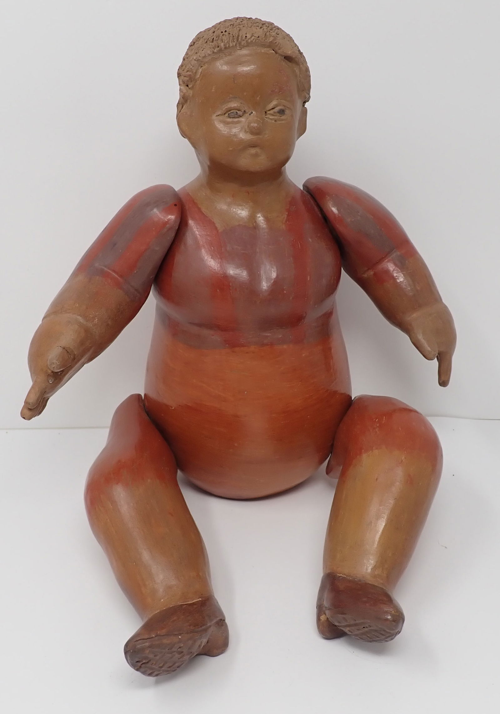 Terra Cotta / Redware Jointed Doll: Apprx 11 3/4" tall ( as pictured). Shipping available