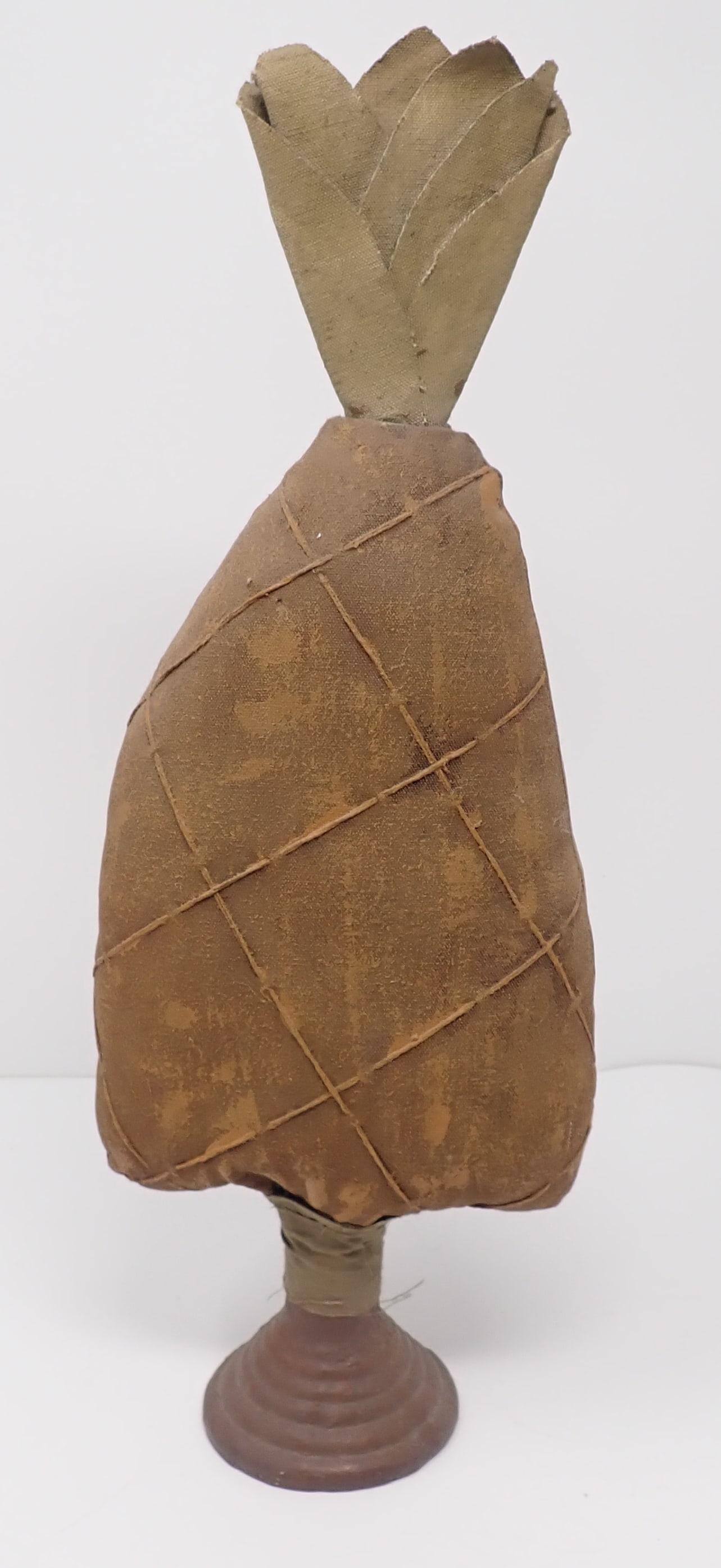 Decorator Pineapple: Cloth pineapple w/ resin or pottery base. Approx 5 1/4" wide and 14 1/2" tall. Shipping available