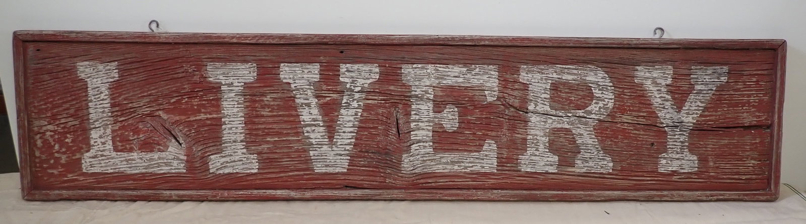 Livery Sign in Red Paint: Approx 13" x 59 1/2". NO in house shipping