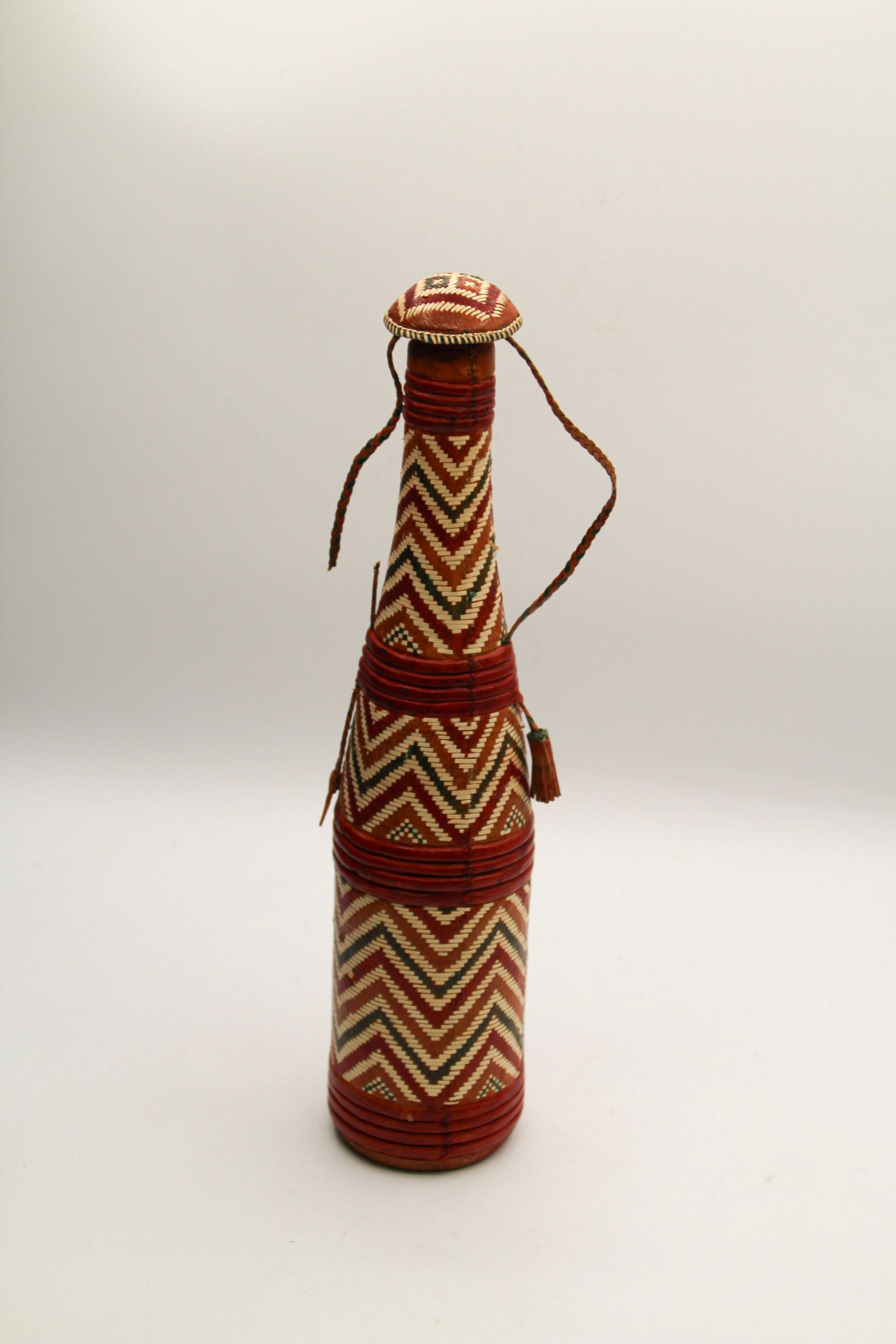Leather Woven Glass Decanter: Approx 13 1/4" tall. Shipping available