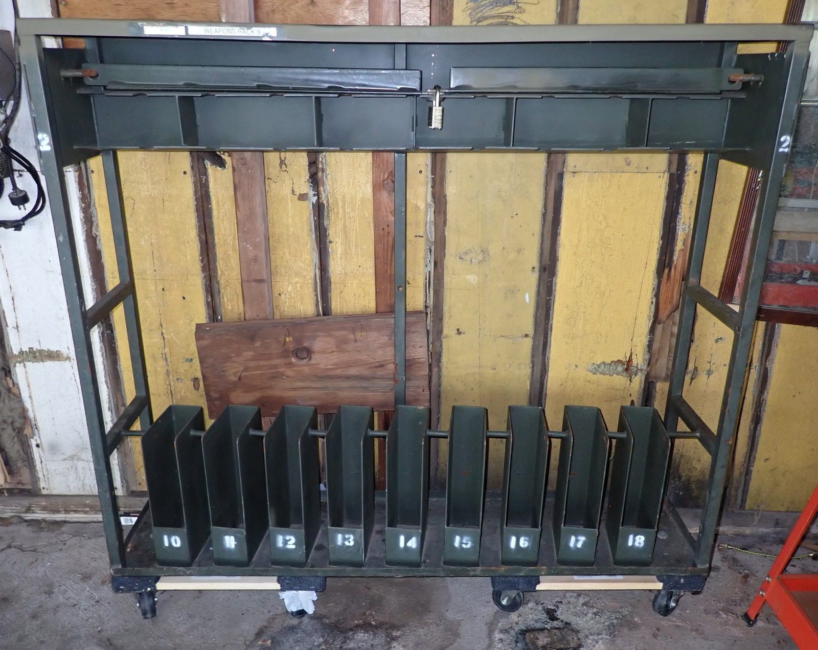 Weapons / Gun Rack: Approx 12" x 51"x 48 1/2" tall. It is on casters and rolls nice. No in house shipping ! Bring help to load !