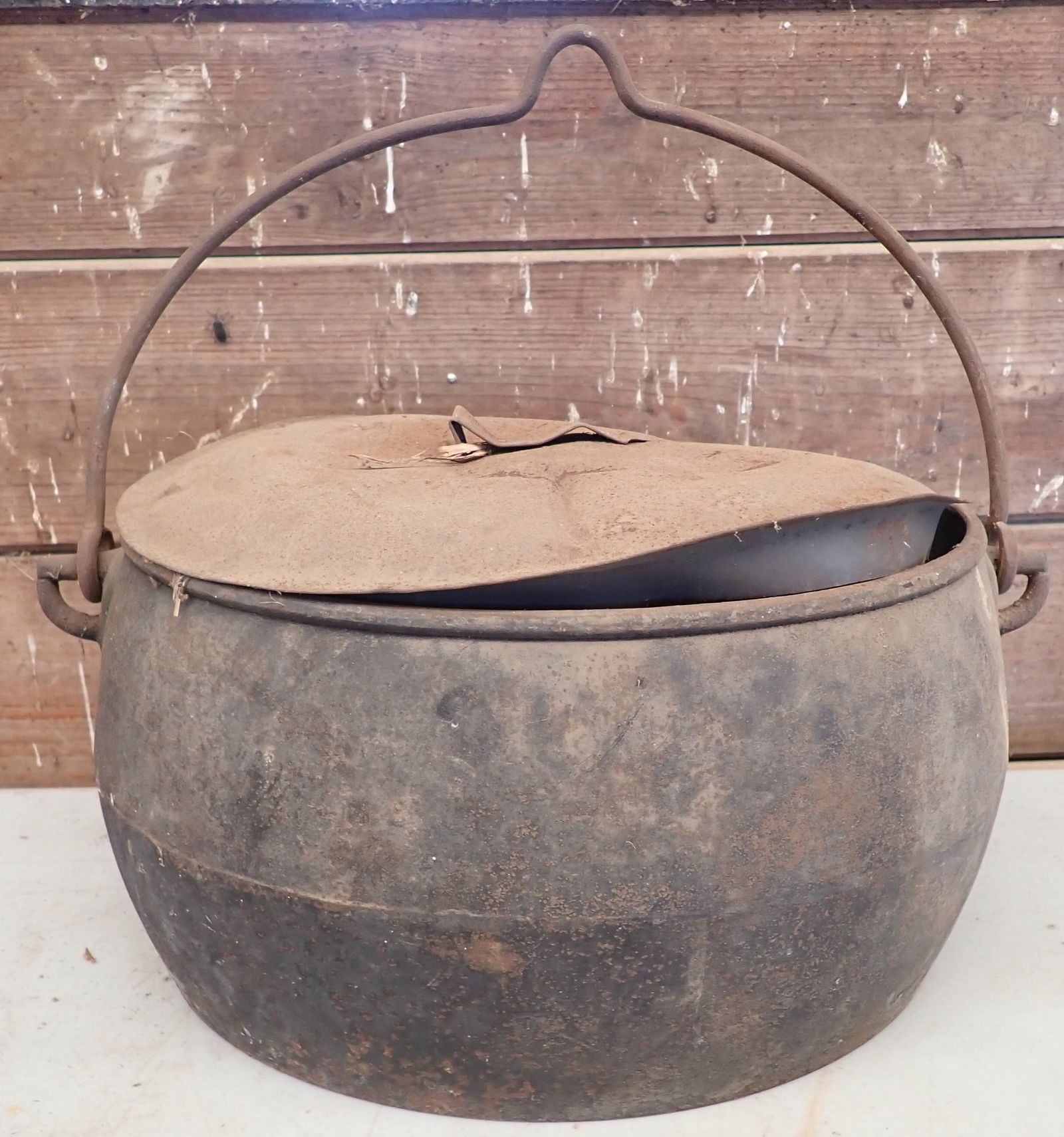 Cast Iron Kettle: Approx 11 1/2" x 17 1/2" x 8 1/4" tall. Shipping available ($20 handling charge, plus postage)