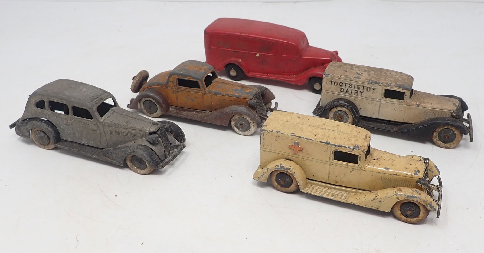 Tootsietoy Dairy , Ambulance, & Misc Cars: Back one is an Auburn rubber. Tootsietoys are approx 3 1/2" long. Shipping available