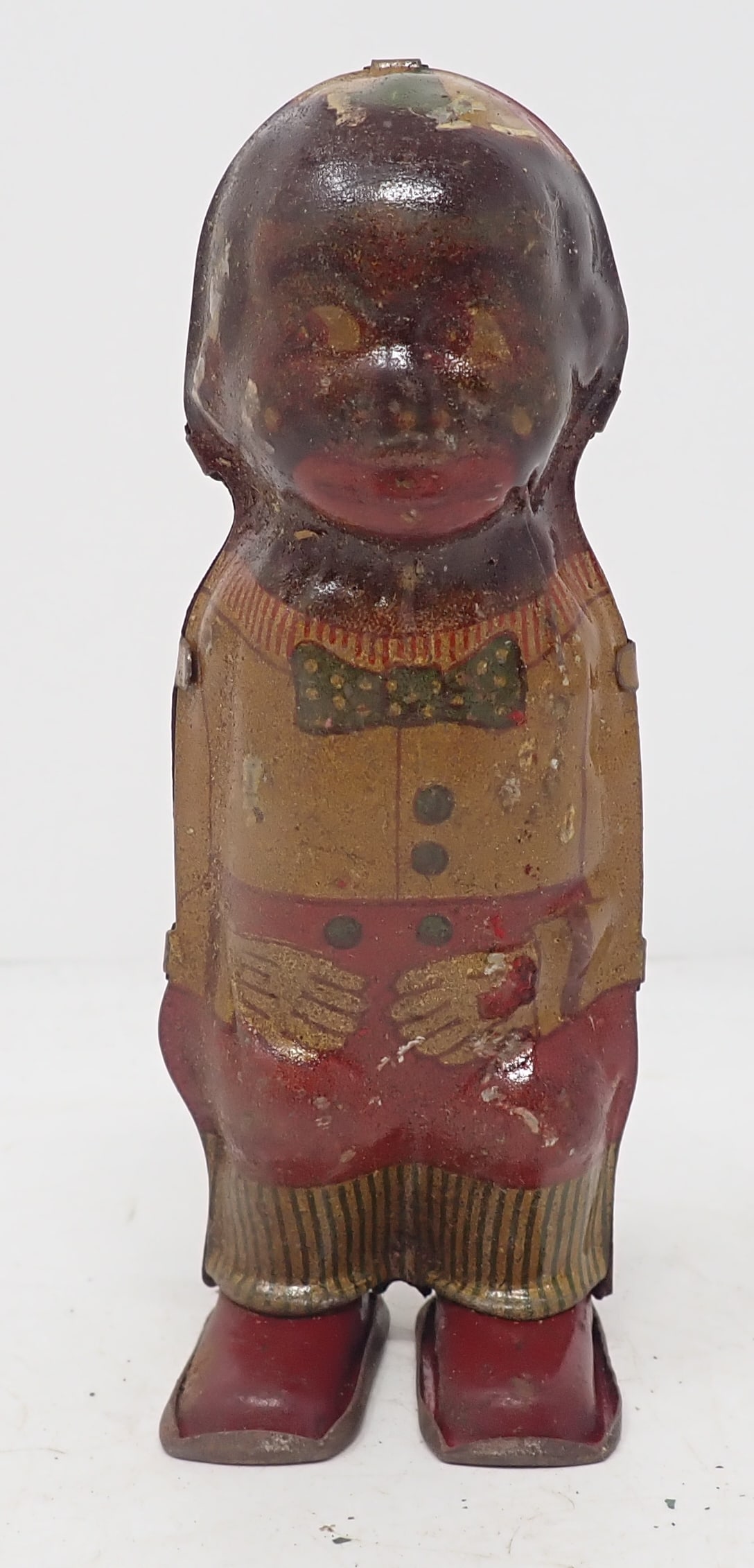 Black Americana Tin Lithograph Wind Up Toy: Approx 4 1/2" tall. Shipping available