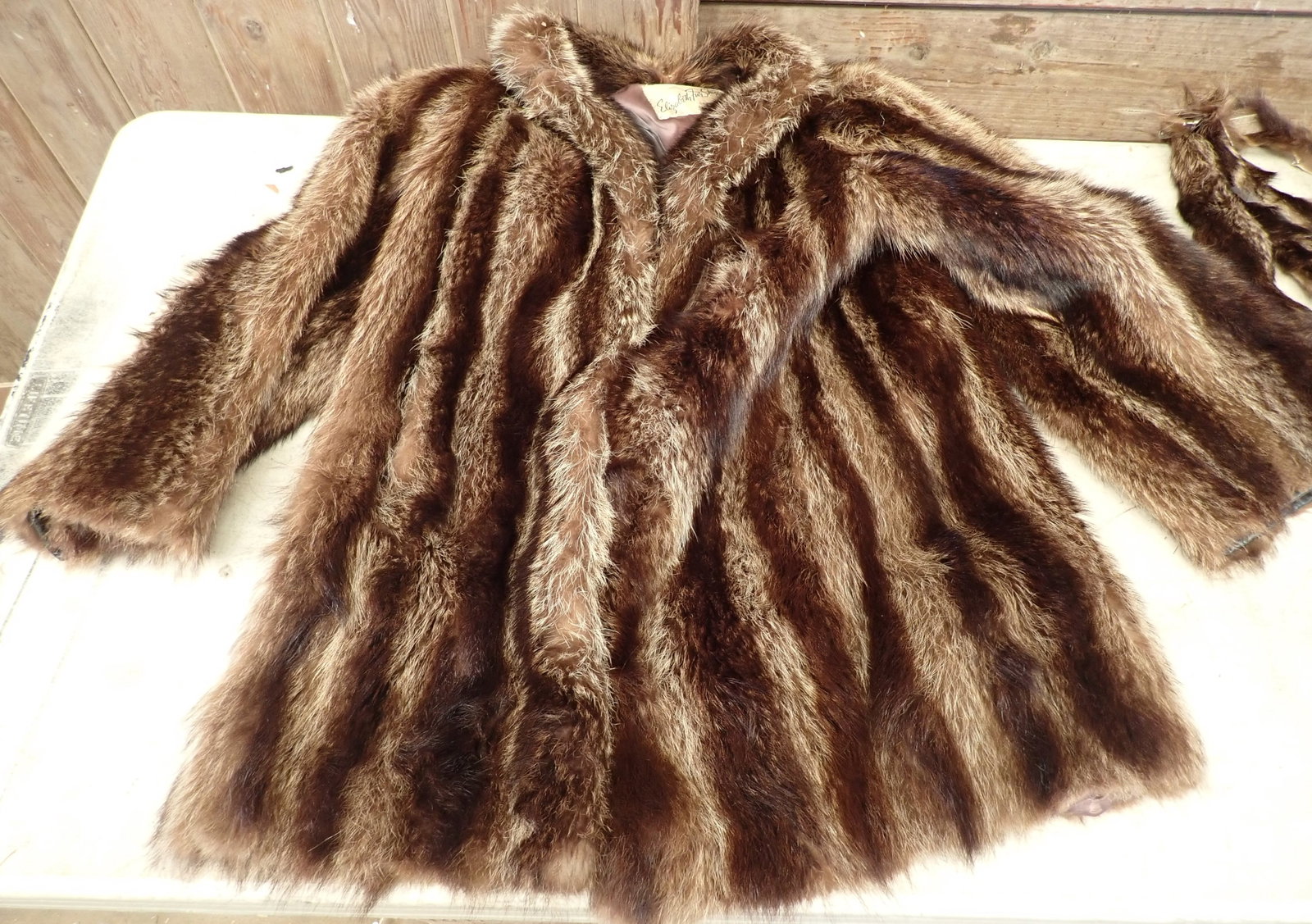 Raccoon Fur Coat & Womans Garment: Coat is apprx 19" pit to pit and 33" long. Shipping available
