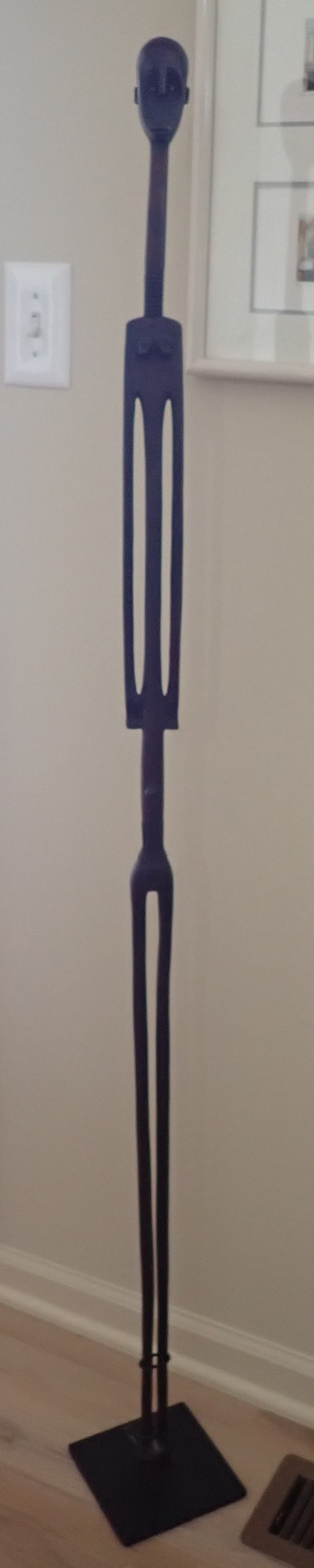 African Sculpture: Approx 2" wide and 59 1/2" tall. Bottom of stand is marked Origins Gallery. No in house shipping !