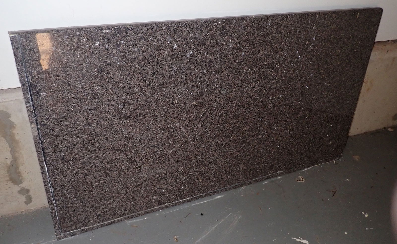 Piece of Granite: Approx 25 3/4" x 49 1/2". Located in garage. Bring help to remove. No in house shipping