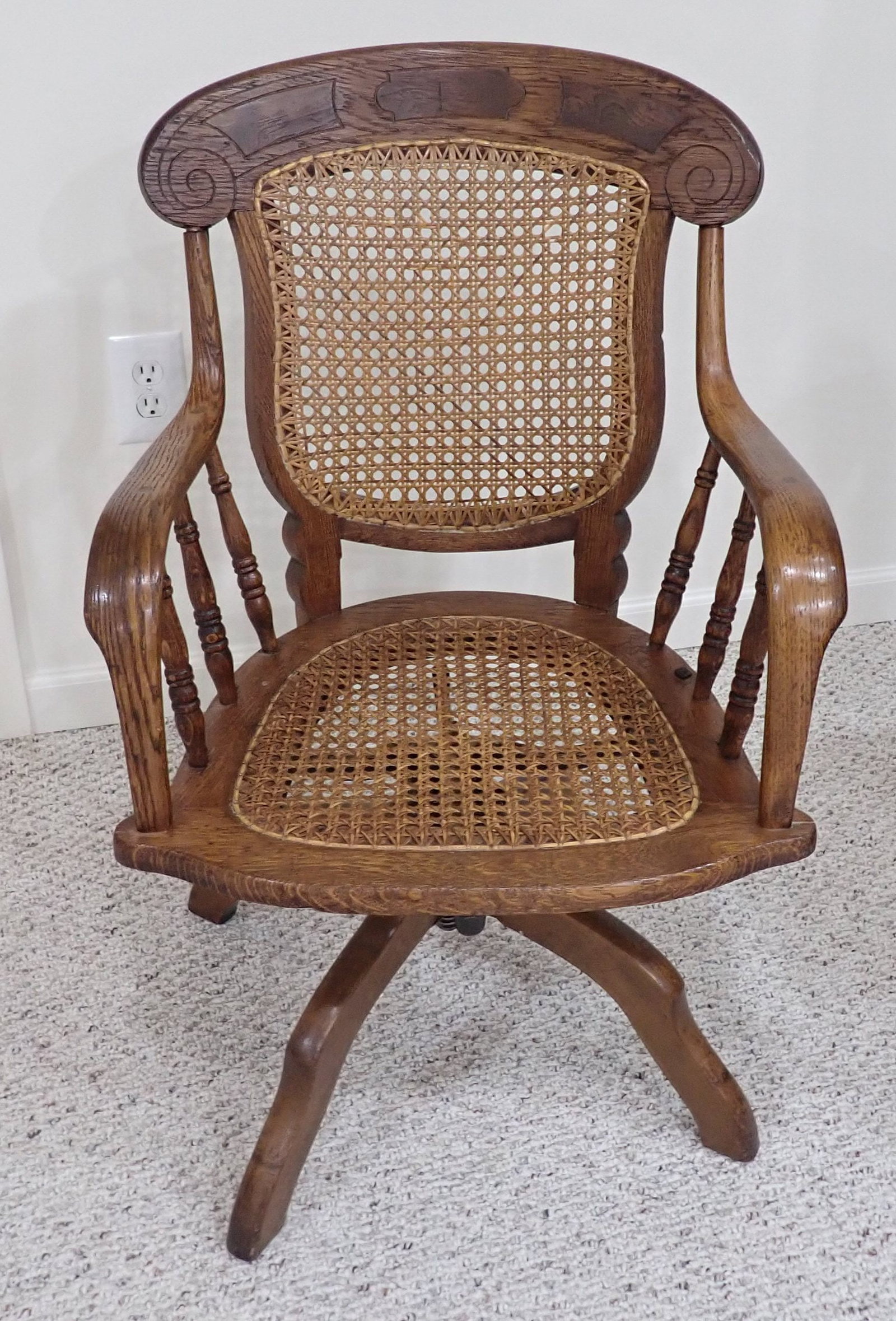 Oak Swivel Desk Chair w/ Cane Seat: Apprx 21 1/2" wide, 15 1/2" tall, 18" deep, and 33 1/2" tall. No in house shipping ! Buyer to remove from basement