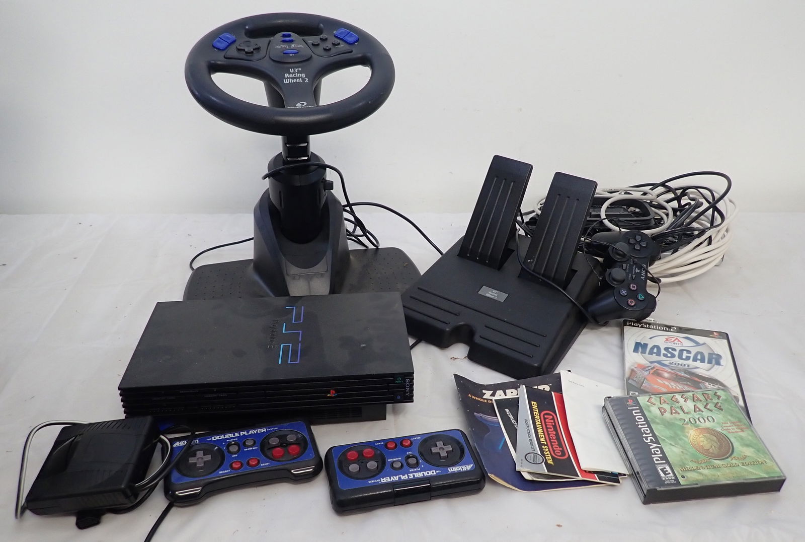 Sony Playstation PS2 w/ Games: Shipping available ($20 handling charge, plus postage). We will not ship tote.