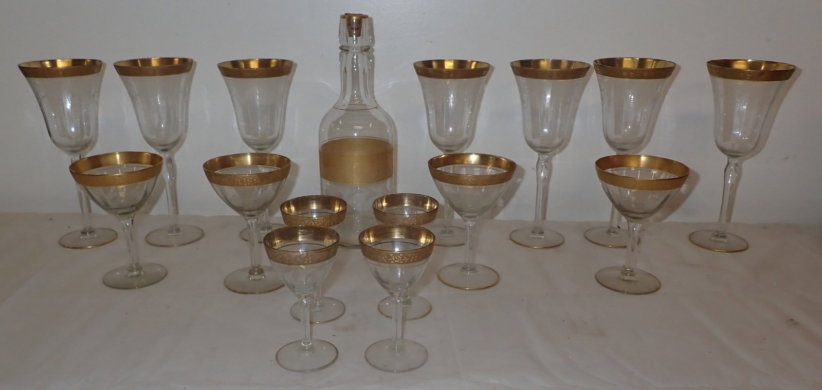 Stemware & Decanter w/ Gold Trim incl Tote: There is one champagne glass that is not included. Had a bad crack and we disposed of it. No in house shipping !