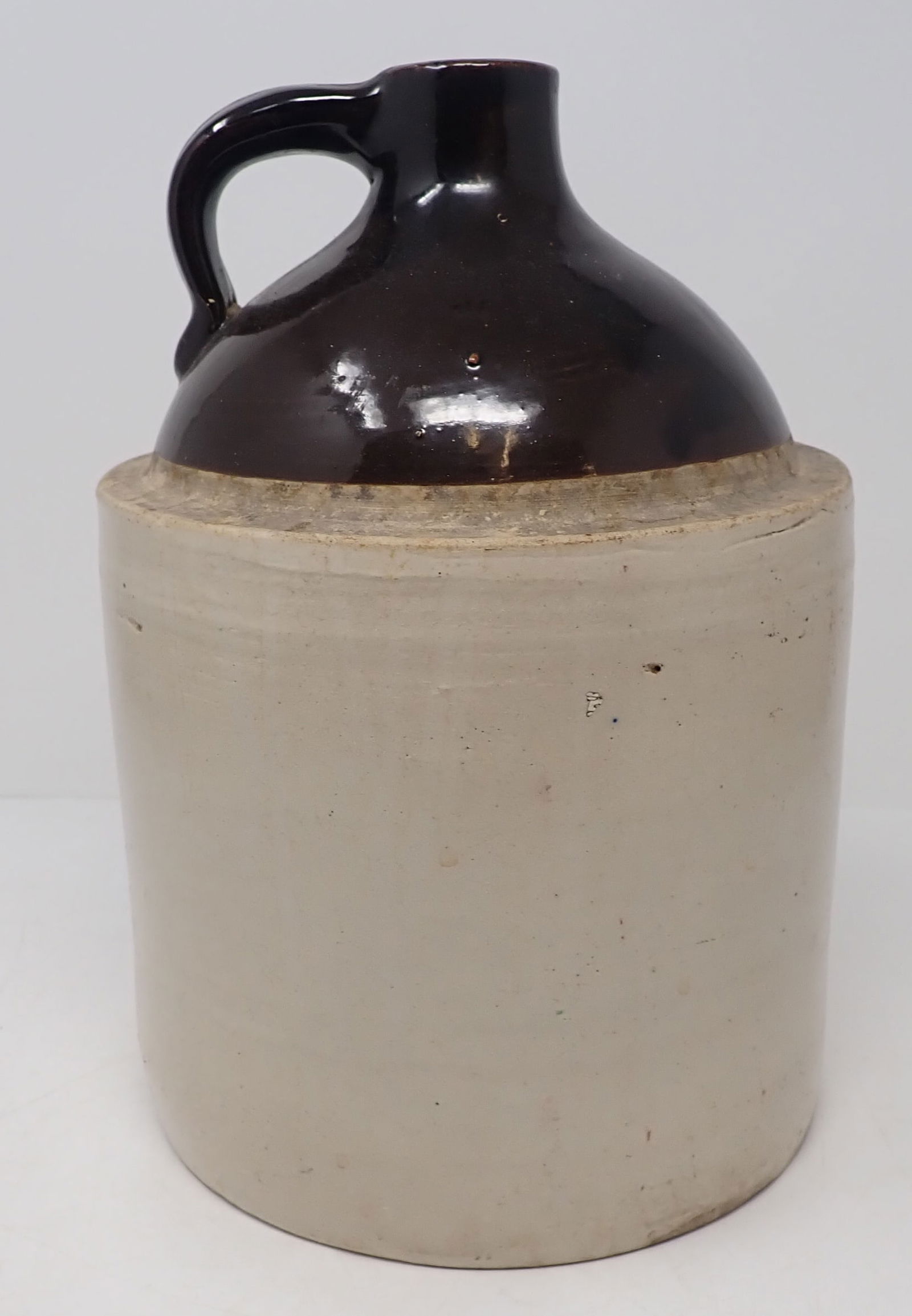 Stoneware Jug: Approx 7 1/4" in diameter and 10 3/4" tall. Shipping available