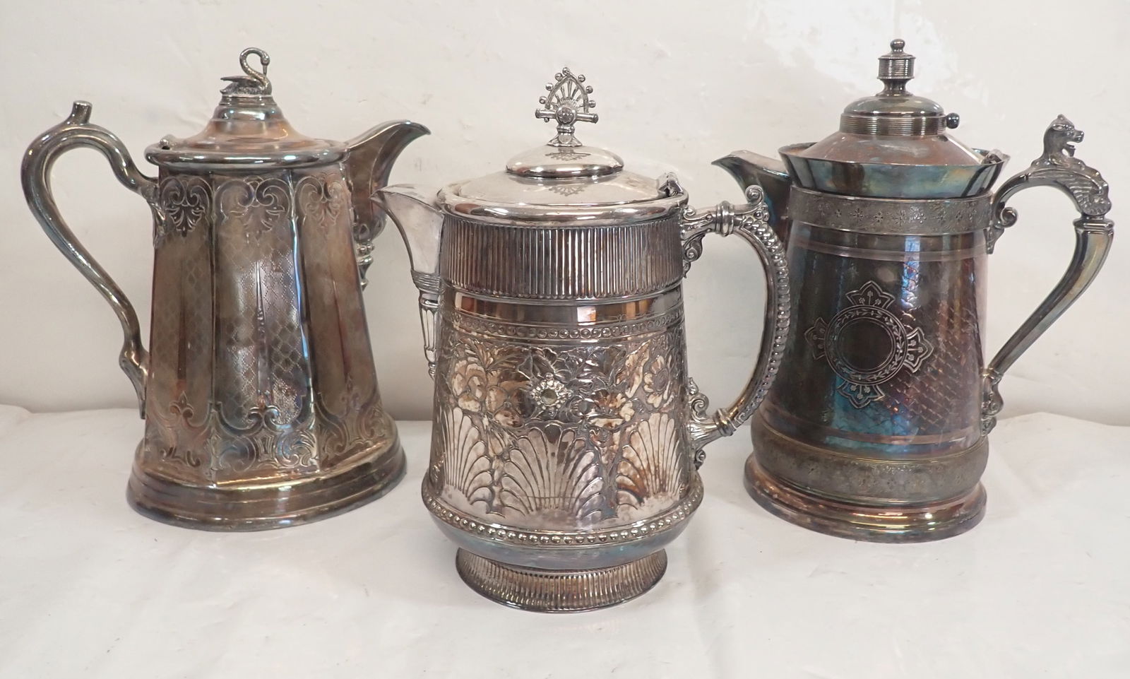 Silverplate Teapots: Tallest is apprx 12 3/4" tall. Shipping available ($20 handling charge, plus postage)