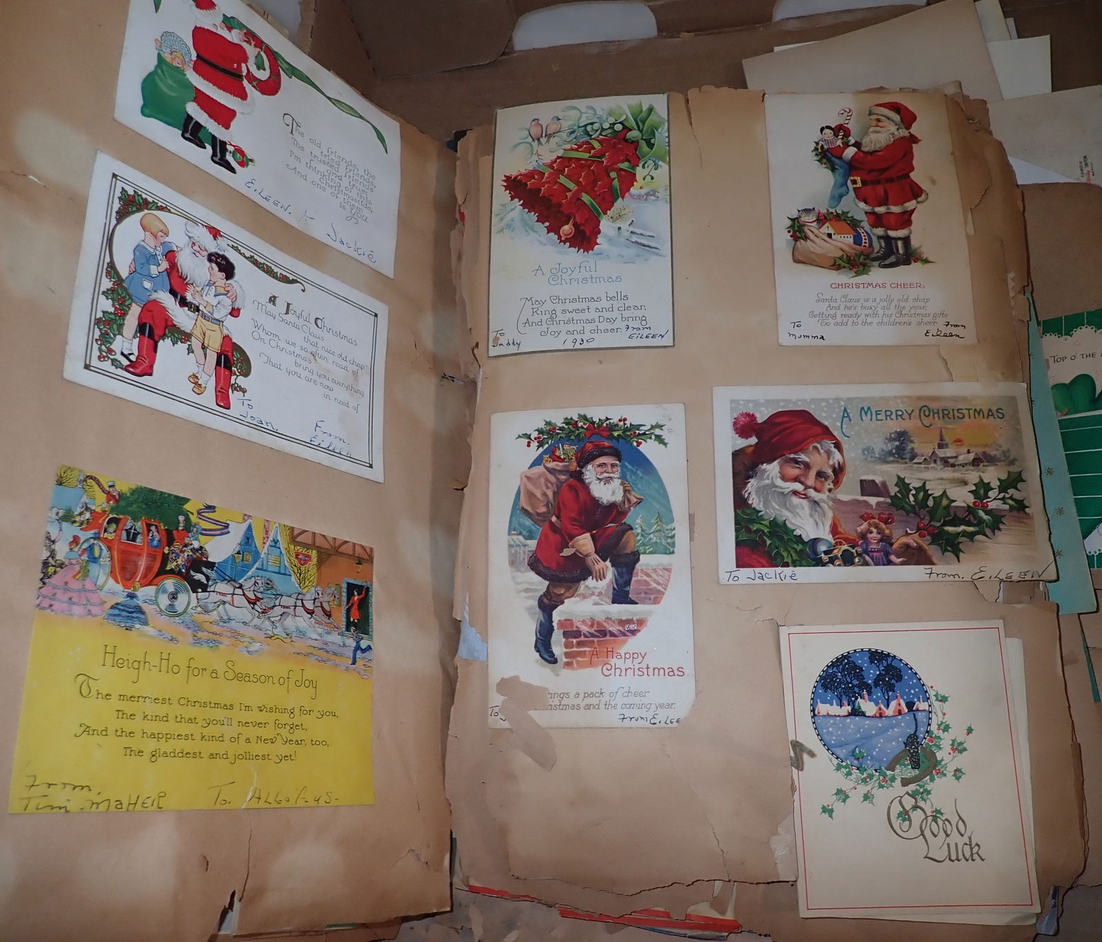 Scrapbook Album w/ Greeting Cards & Chrismas Postcards: Most are glued or taped to pages. Shipping available