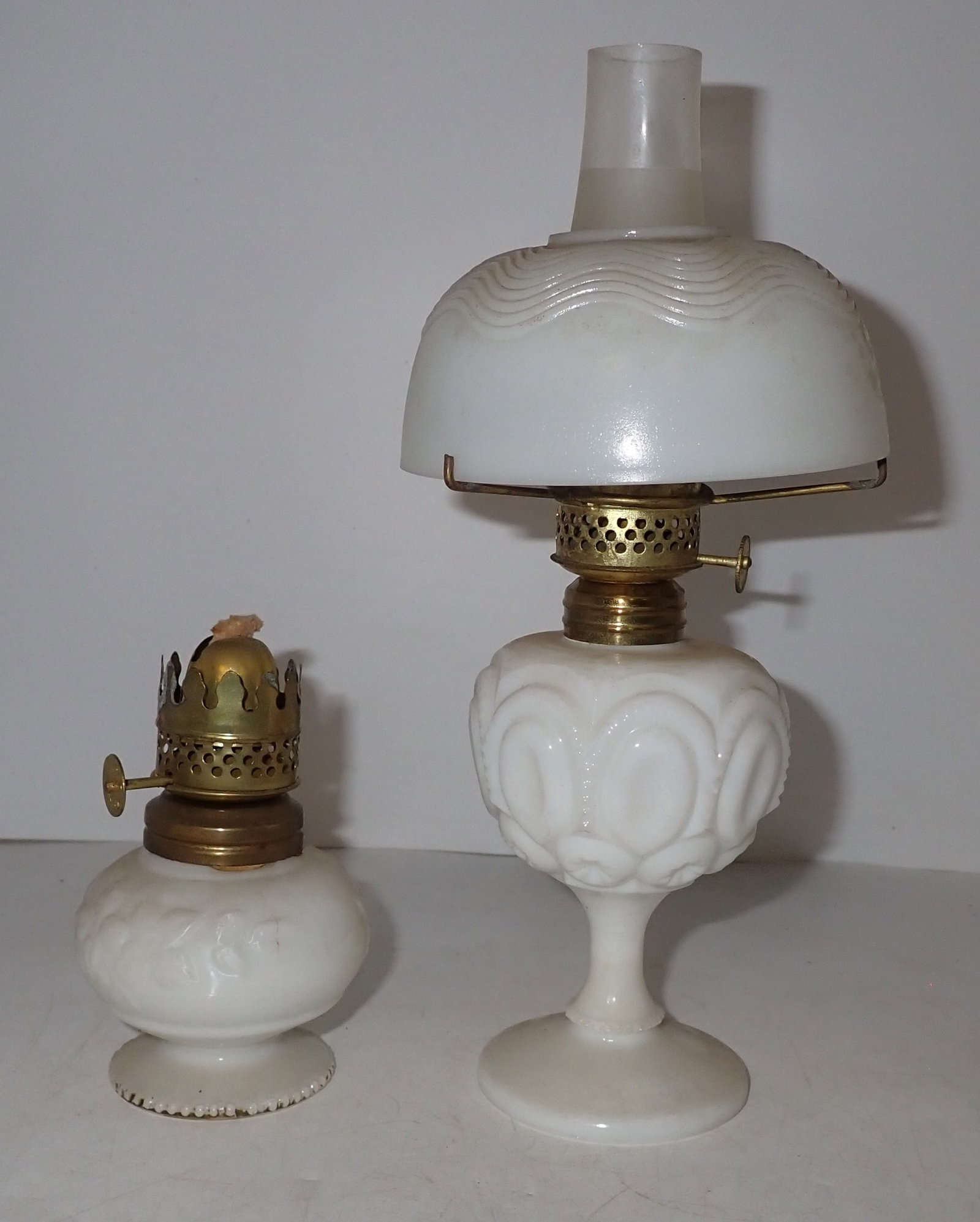 2 Miniature Milk Glass Oil Lamps: Tallest is approx 9" tall. Shipping available
