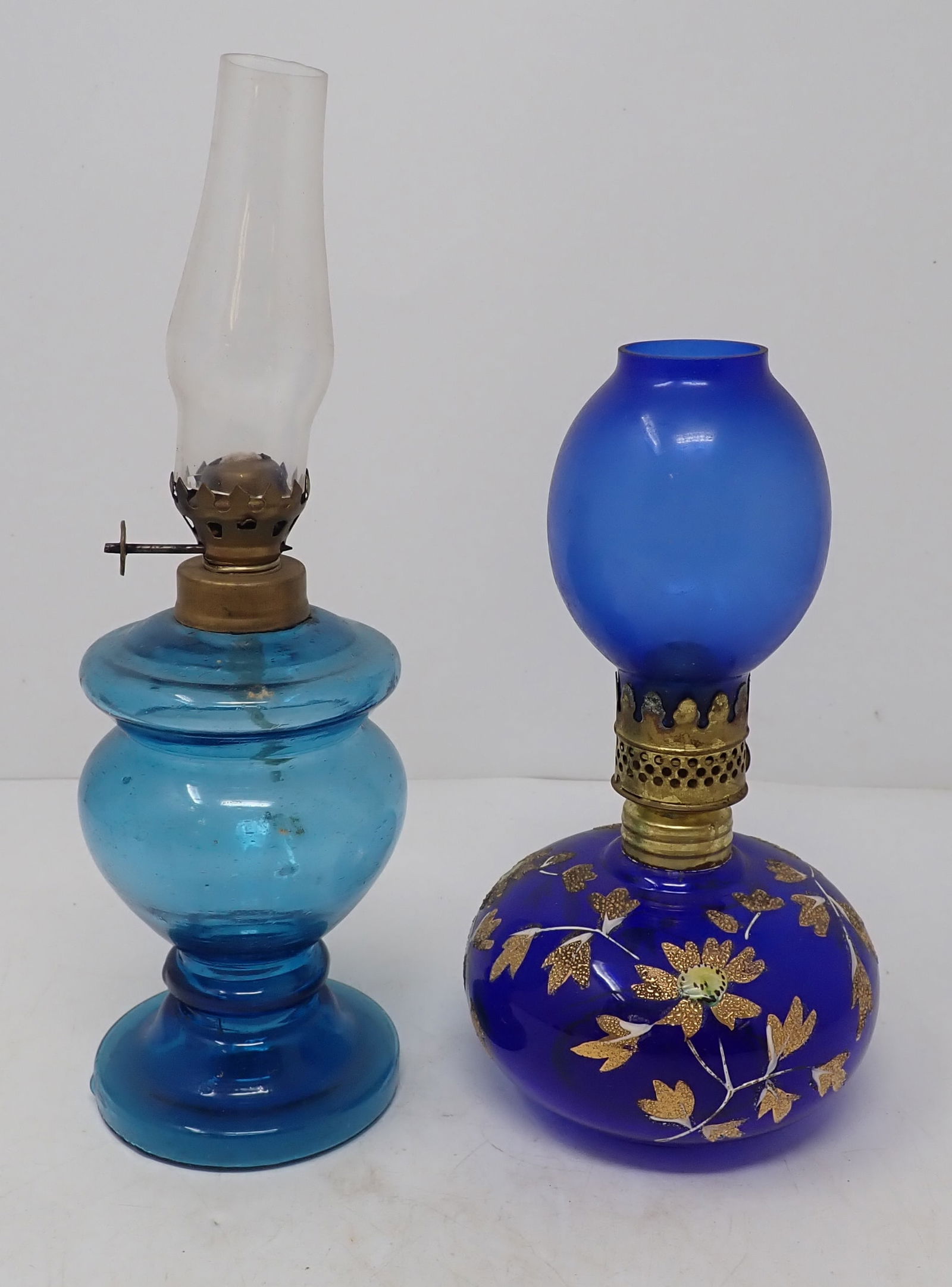 2 Miniature Oil Lamps incl Cobalt w/ Gold Painted Floral Pattern: Tallest is approx 9 1/2" tall. Shipping available