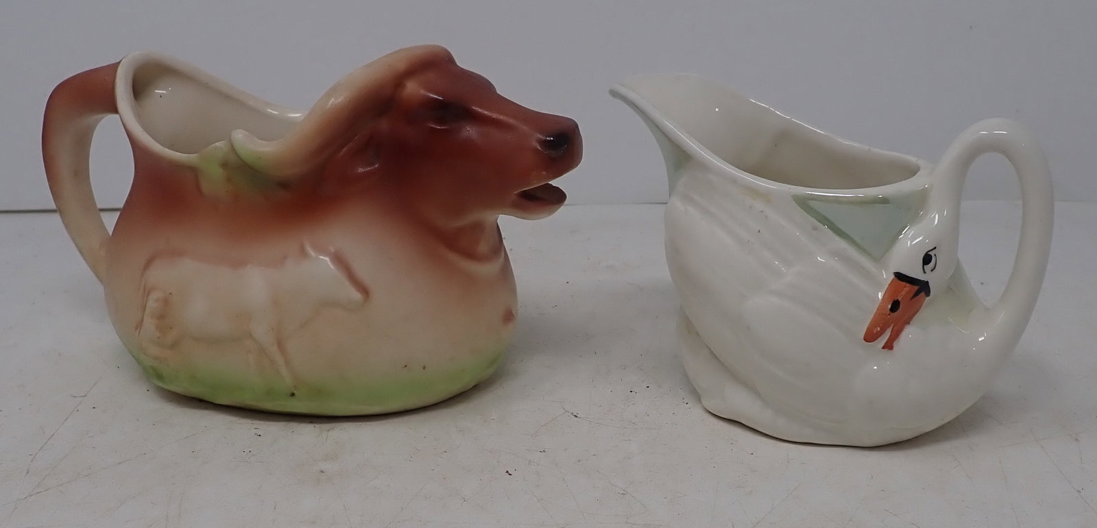 Czecho-Slovakia Cow & Swan Creamers: Cow creamer is apprx 3 7/8" tall. Shipping available
