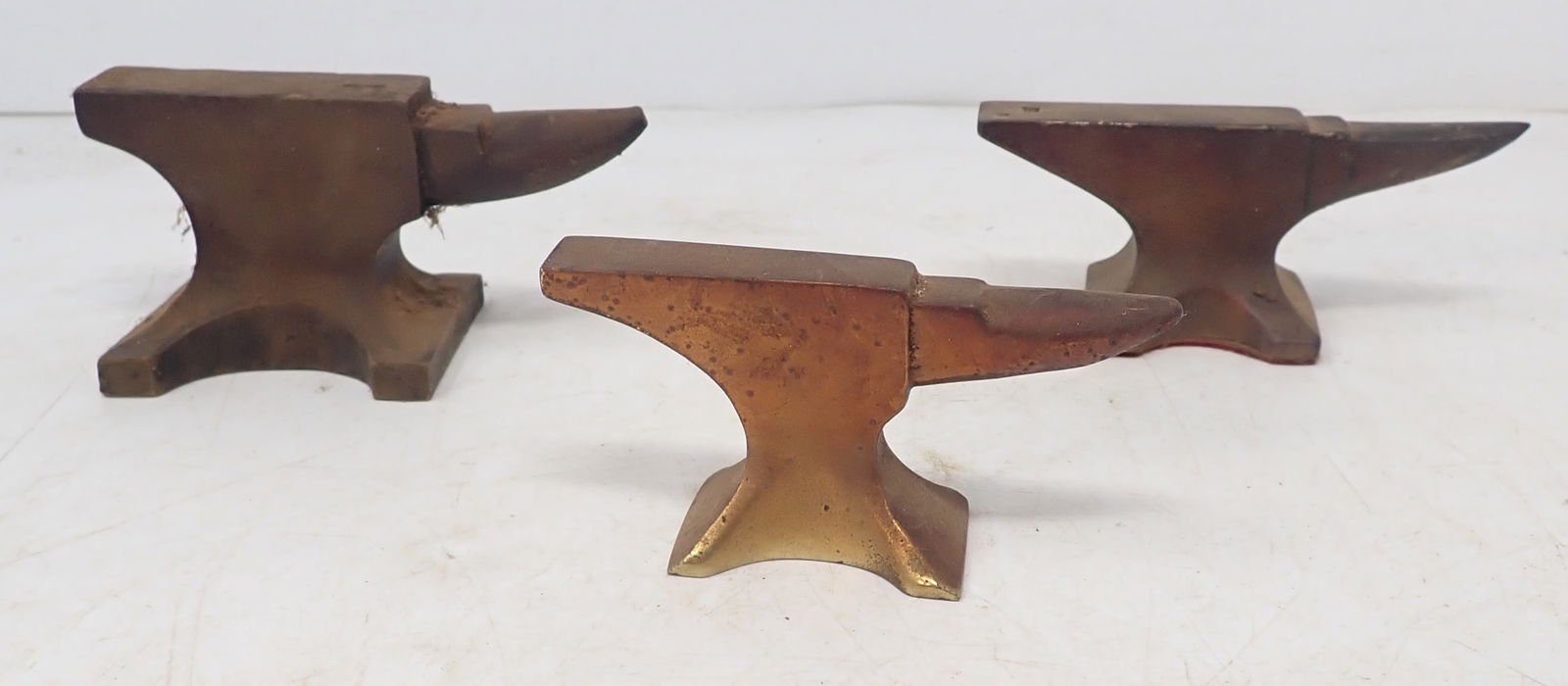 3 Bronze Anvil Paperweights: Largest is approx 1 7/8" x 2 1/8" x 2" tall. Shipping available