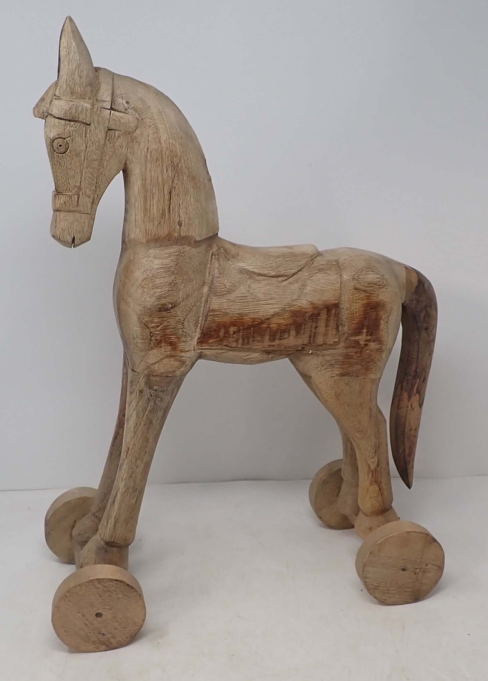 Wood Carved Pull Style Toy Horse: Approx 5 3/8" x 11 7/8" x 17 1/4" tall. Wheels do not turn. Shipping available.